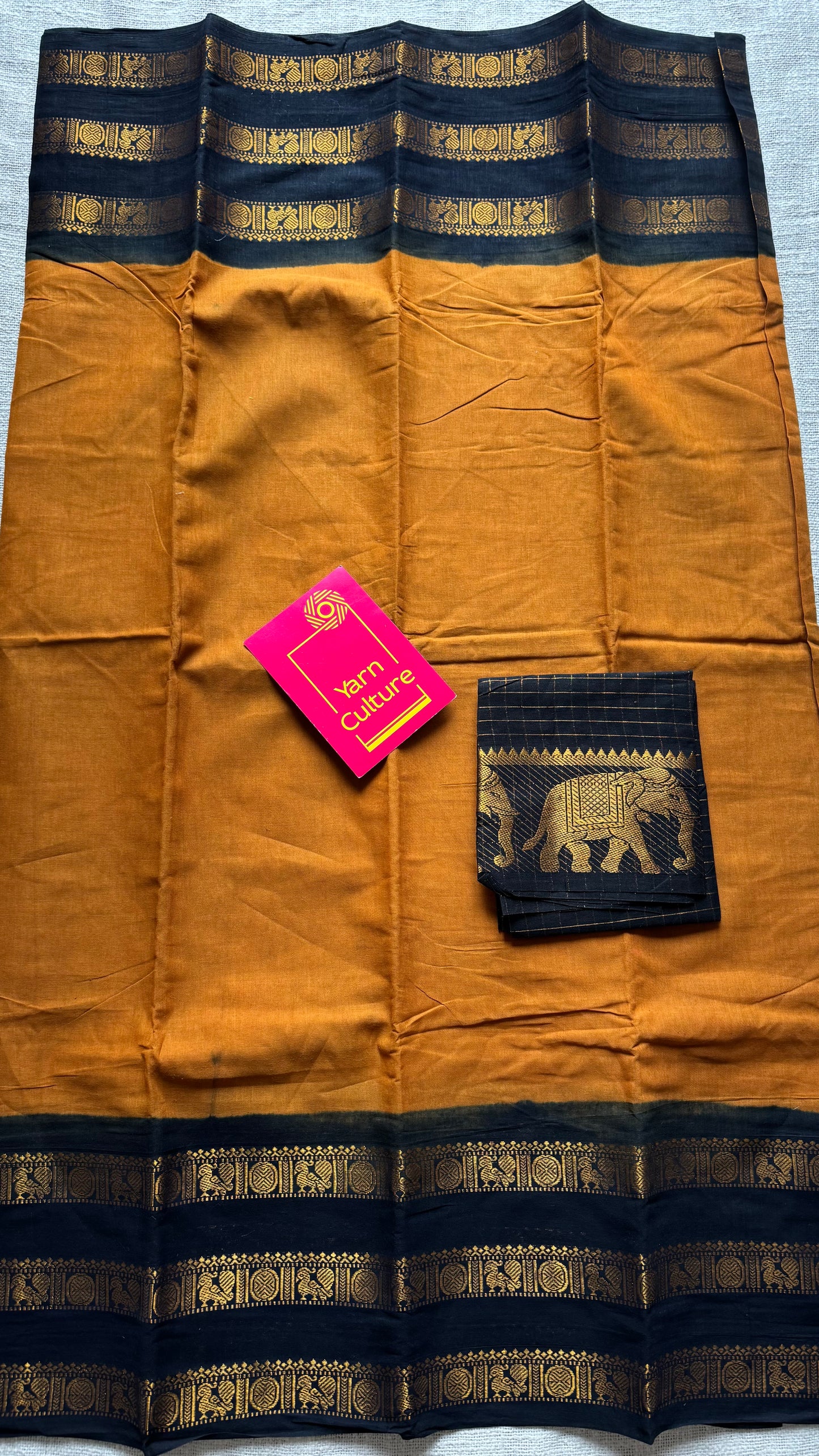 Turmeric yellow with black border, peacock and rudraksham motif, madurai soft cotton - YCCOTNJUSC01
