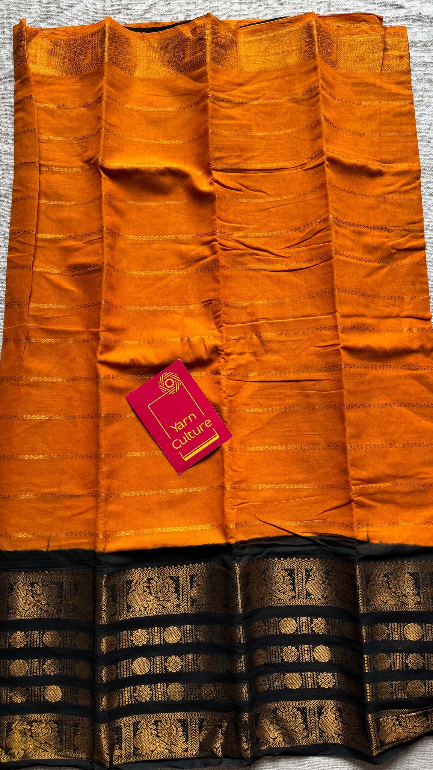 Turmeric yellow (towards orange) with black, peacock rudraksham motif, single side broad zari - madurai kattuchayam dyed - YCCOTNAURS16