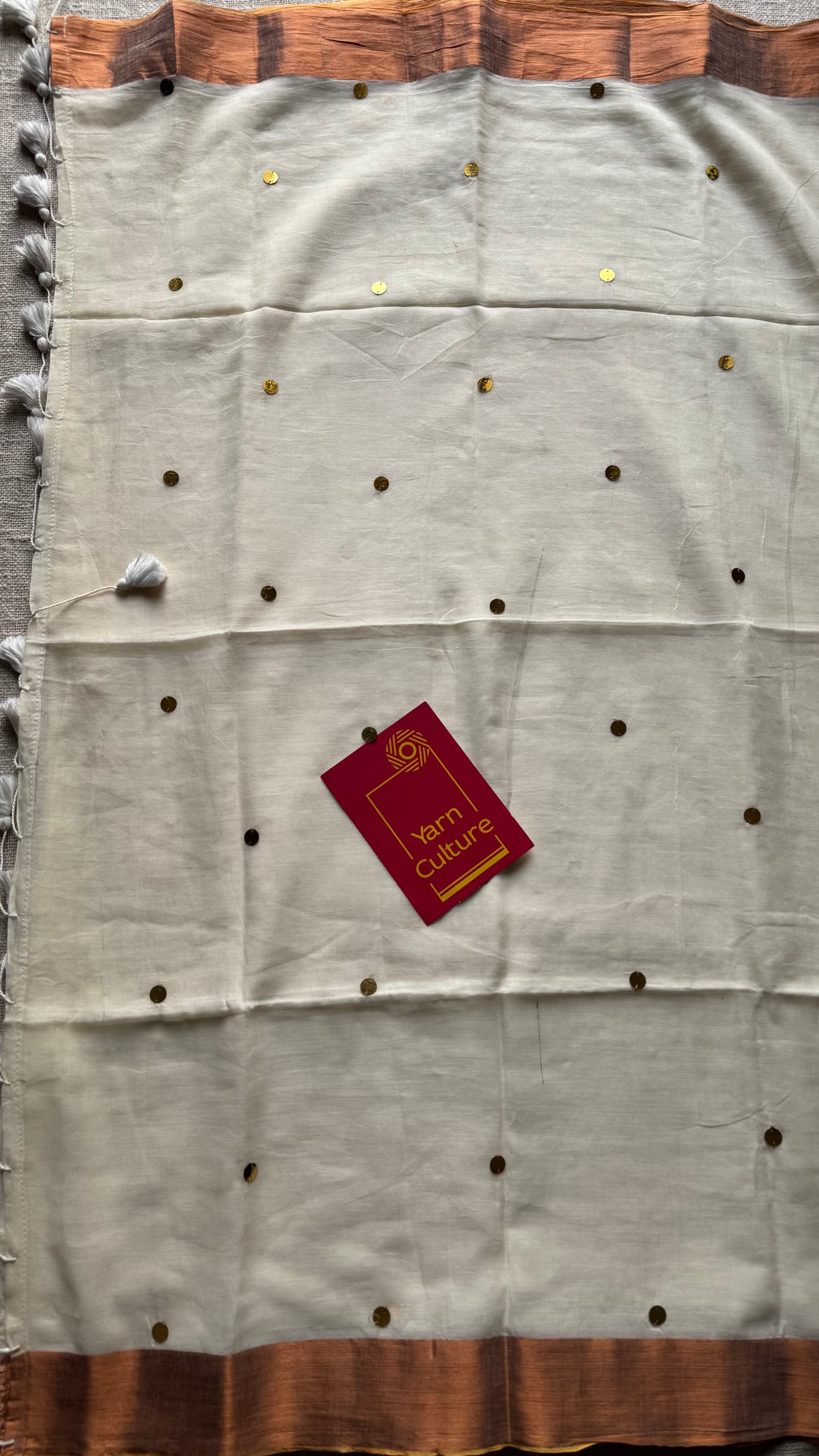 Ivory mul with gini sequins and copper zari border - YCBCMCNO60