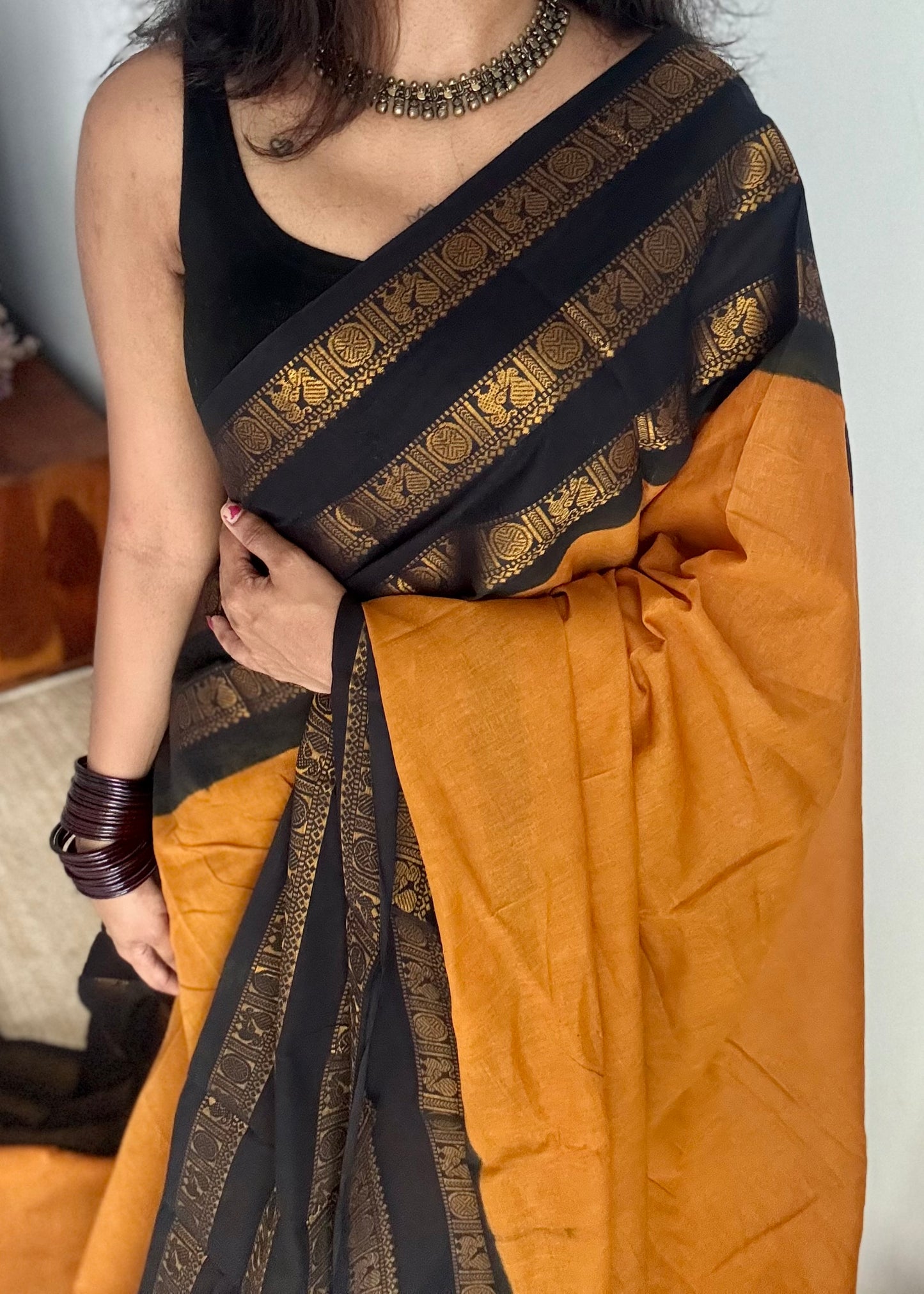 Turmeric yellow with black border, peacock and rudraksham motif, madurai soft cotton - YCCOTNJUSC01