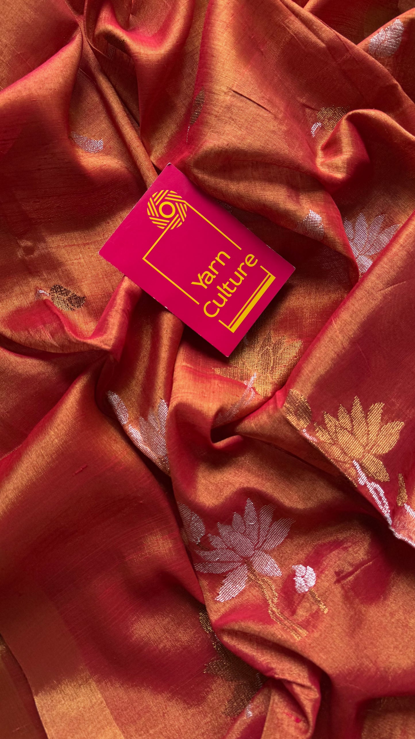 Handwoven orange gold dual tone tissue linen saree with lotus motifs - YCBCLTFE399