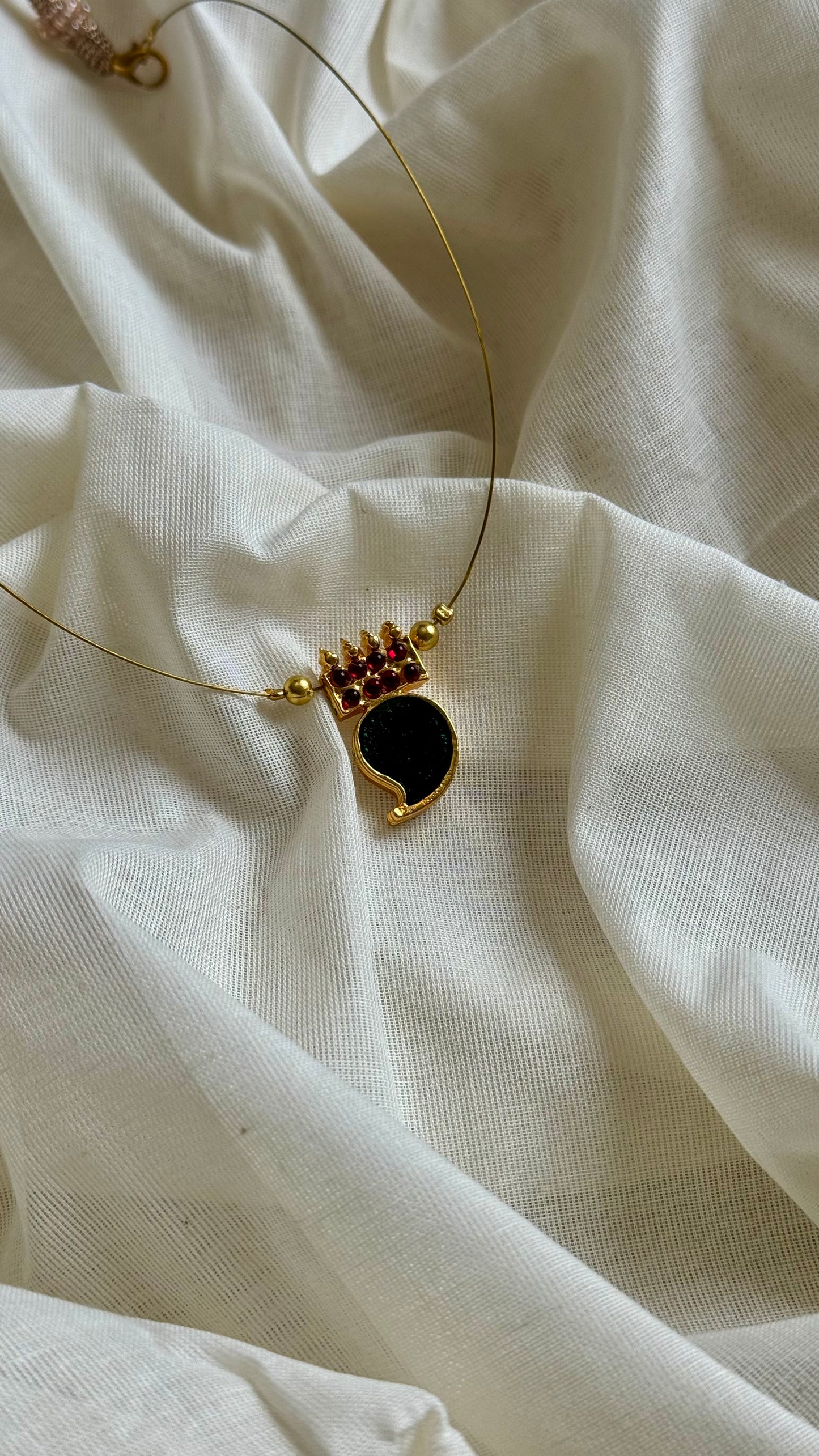 Single mango palakka pendant in invisible chain - YCAGC102