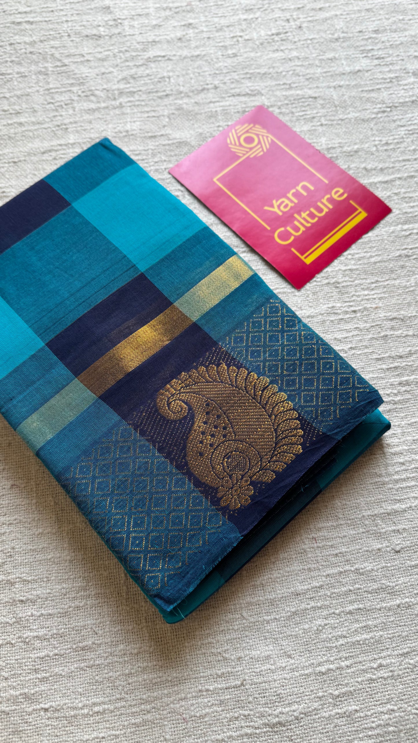 Chettinad cotton saree with sky blue and navy checks, paisley motif border - YCCOTNAP62