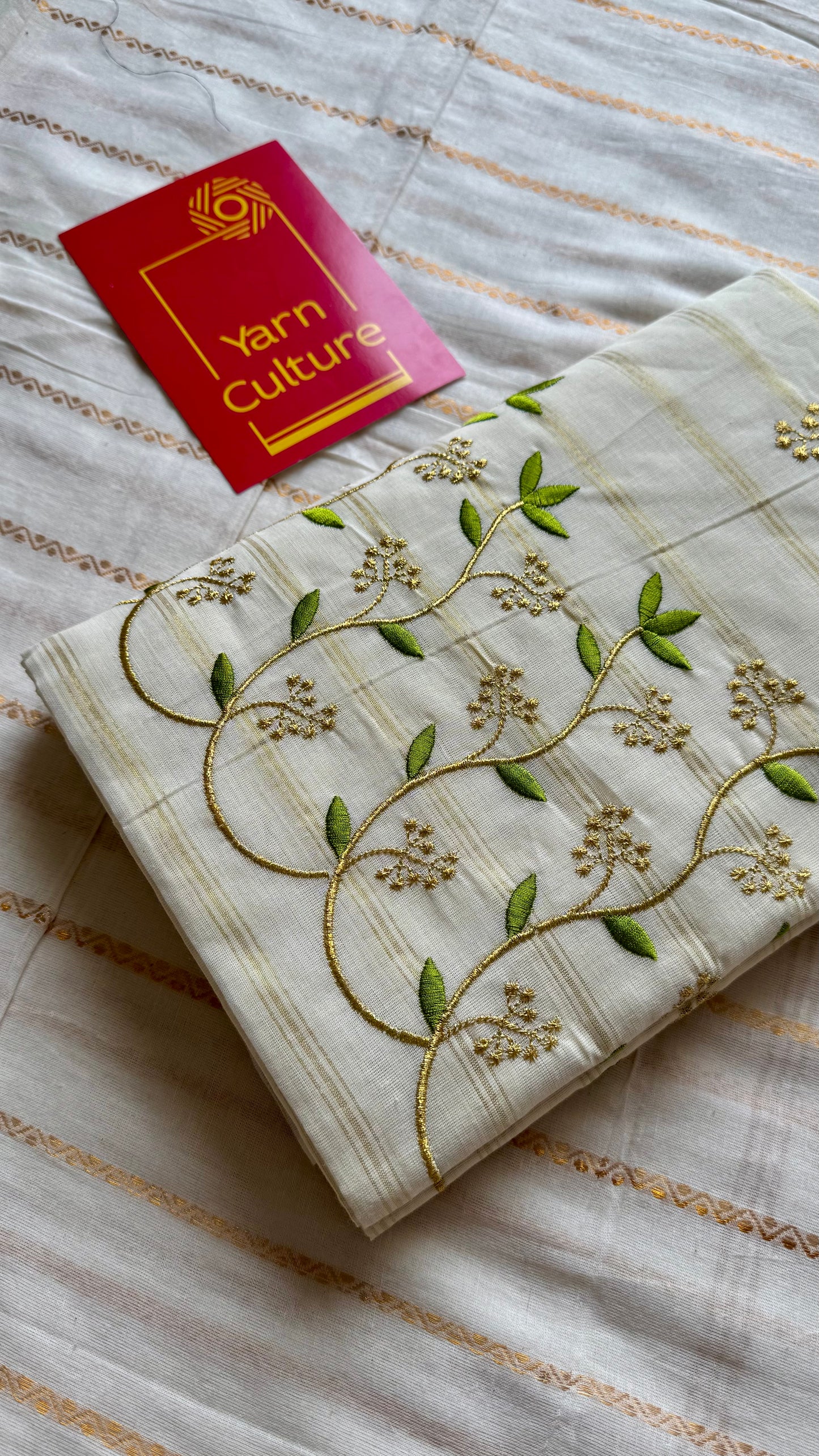 Ivory and gold soft cotton saree, light green floral vine embroidery - YCIEON59