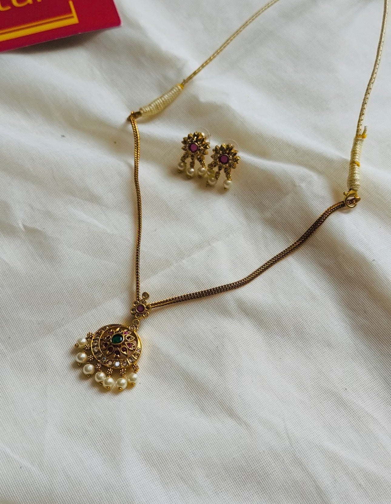 Attigai with ruby, green and white round pendant neckpiece, with earrings - YCGPNP787