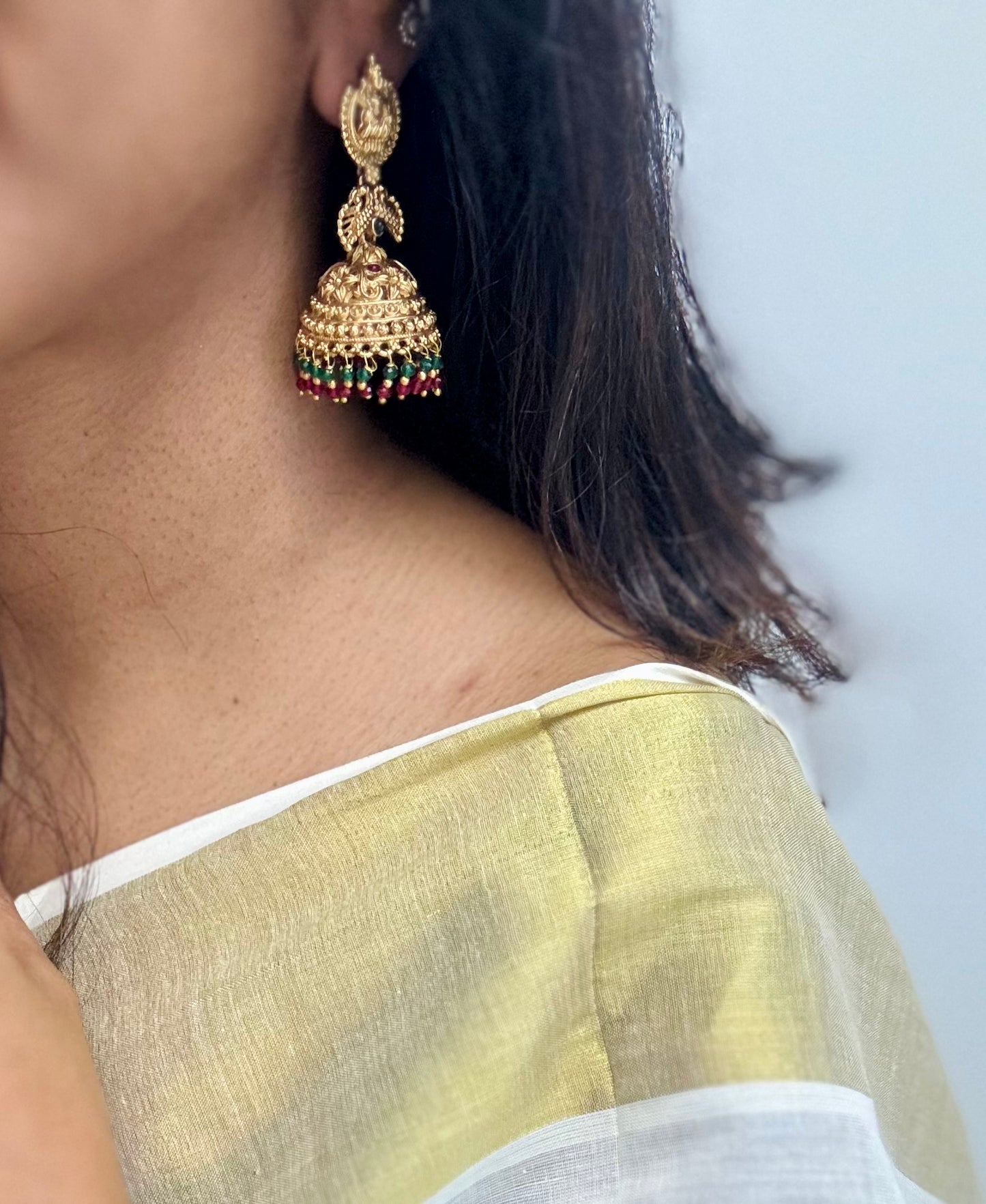 Jhumka with green and dark pink bead drops, gold finishing - YCAGJK87