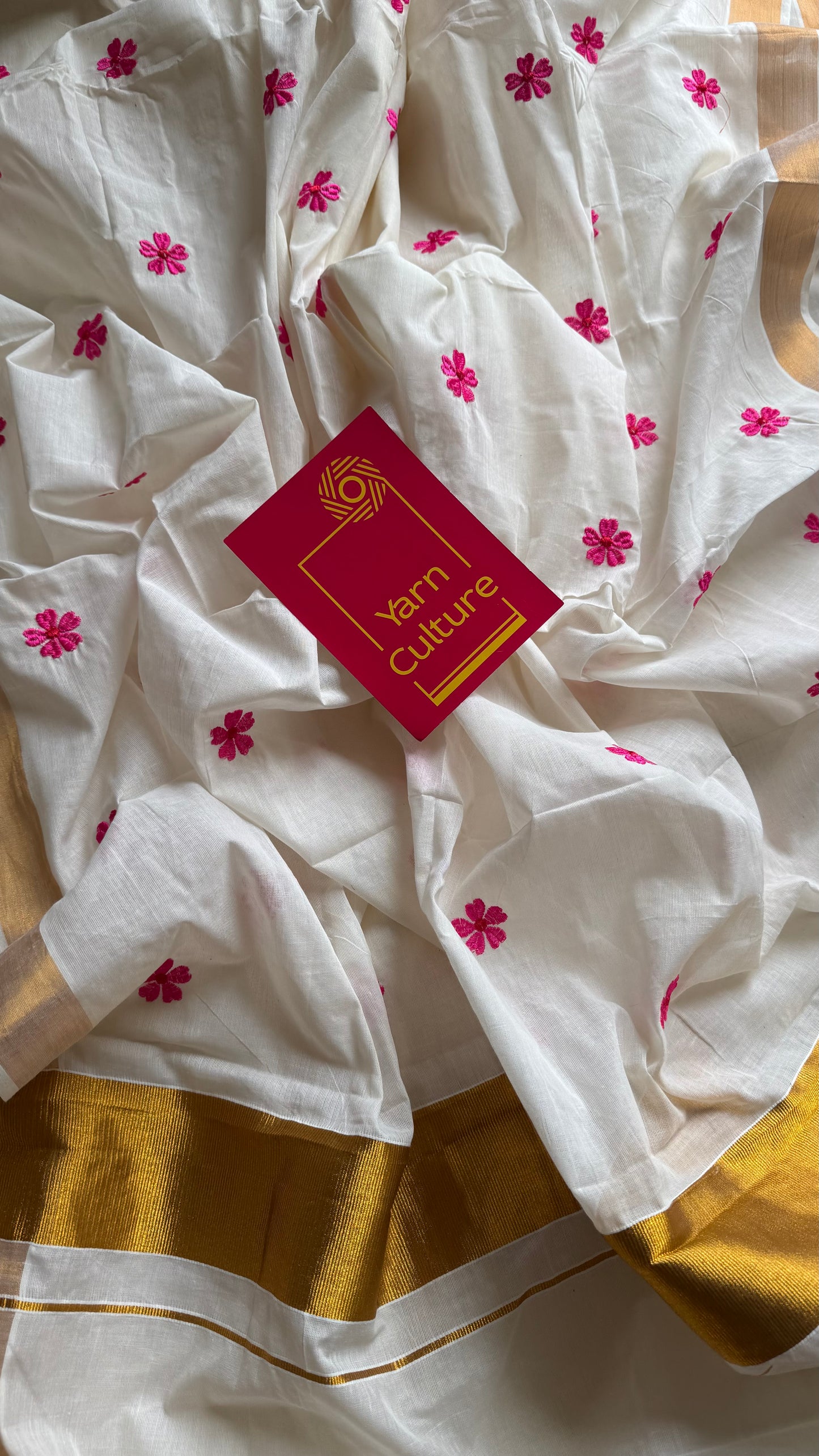 Ivory and antique gold soft cotton kasavu saree, pink parijat floral embroidery - YCIEON155