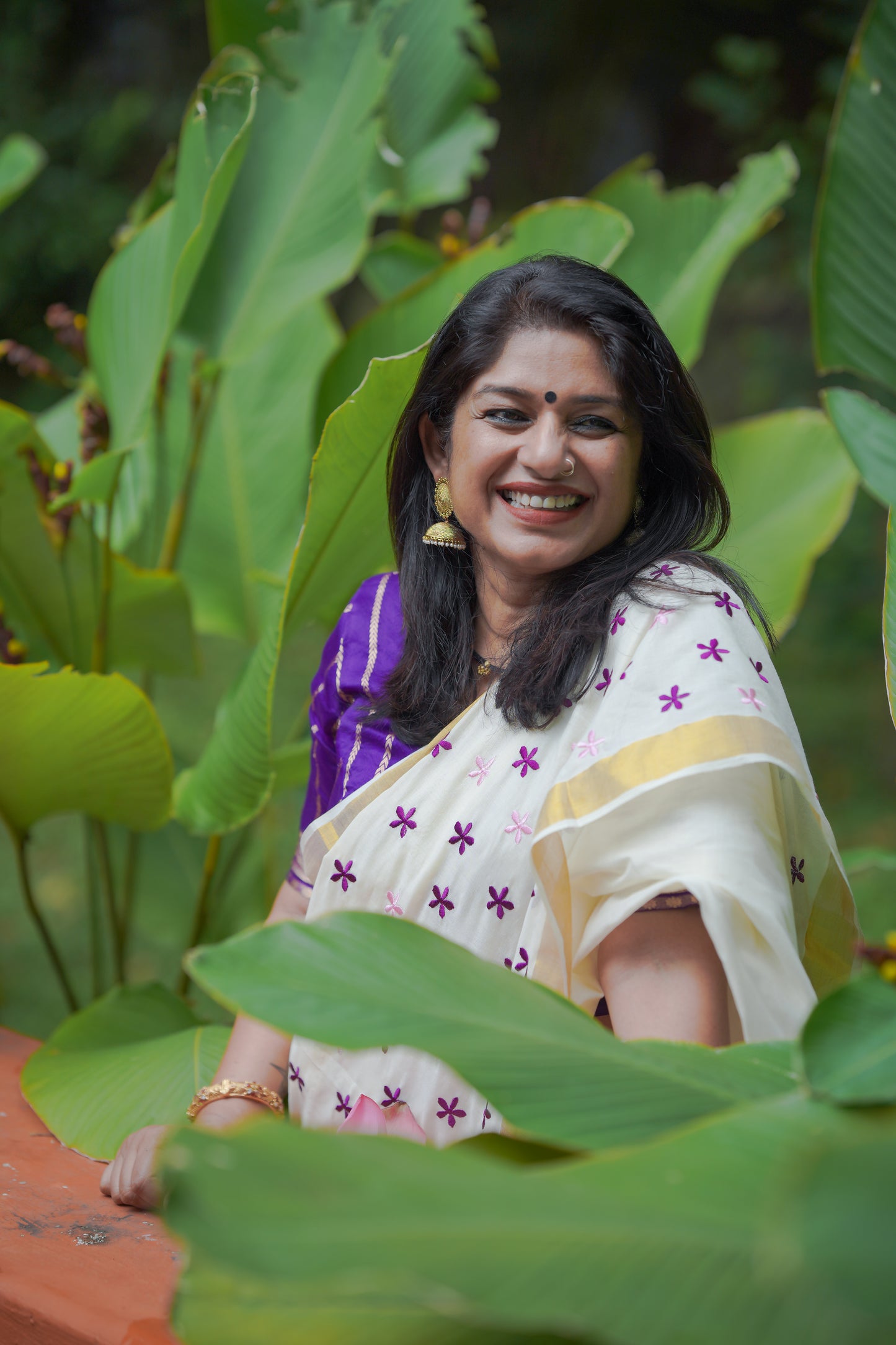 Anjana : Delicate purple and light pink flowers embroidered in soft Kerala cotton - YCONKCE156