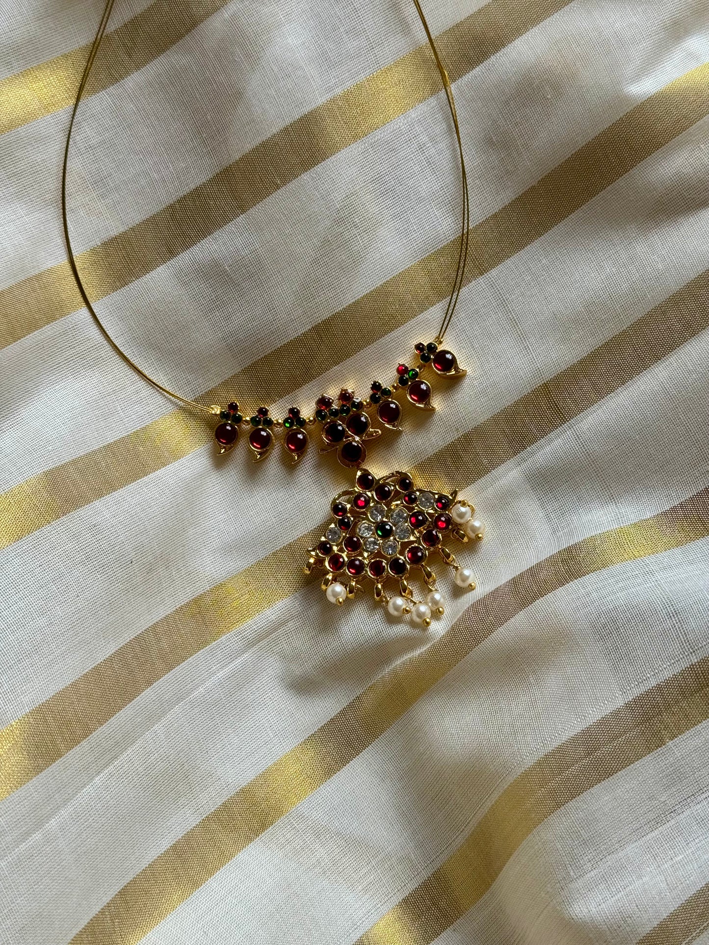 Red and white stone pendant necklace