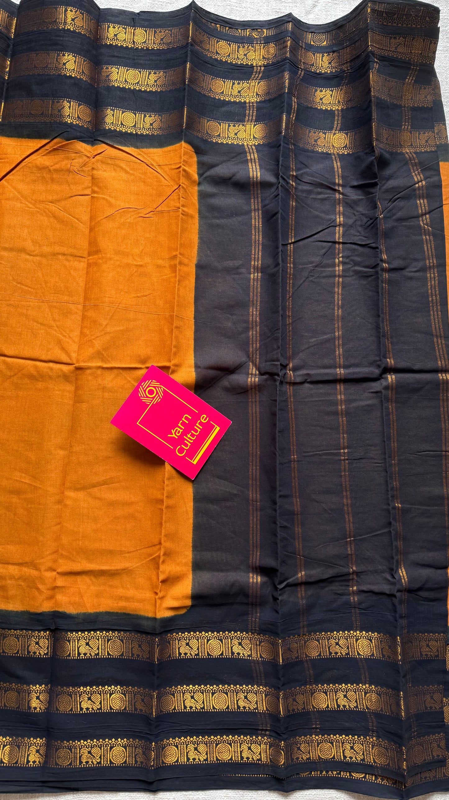 Turmeric yellow with black border, peacock and rudraksham motif, madurai soft cotton - YCCOTNJUSC01