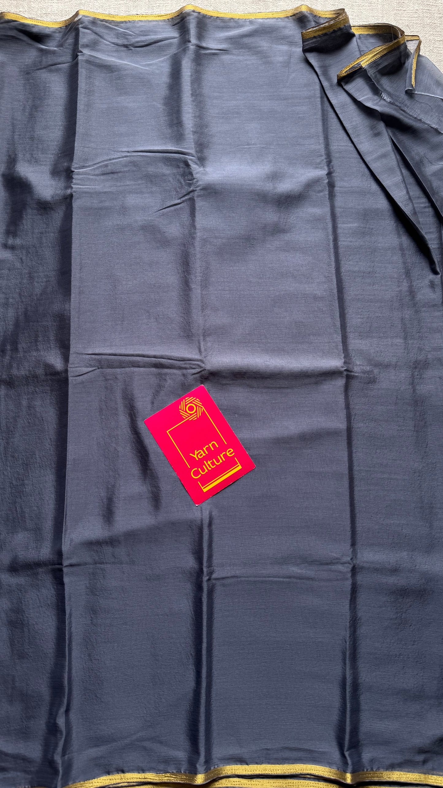 Grey chiffon with thin gold zari border - YCDESE23
