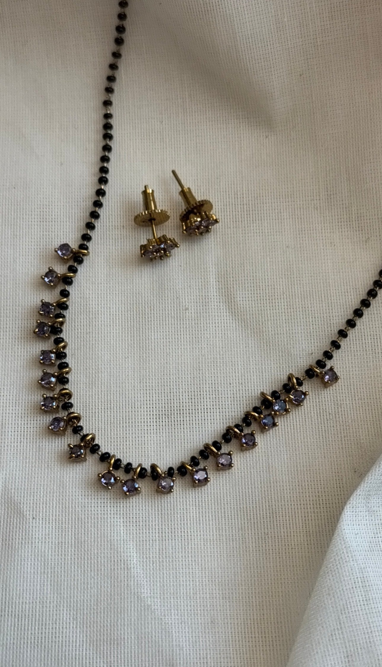 Black beaded (karimani) neckchain with lilac stone pendants, with earrings - YCGPNP810