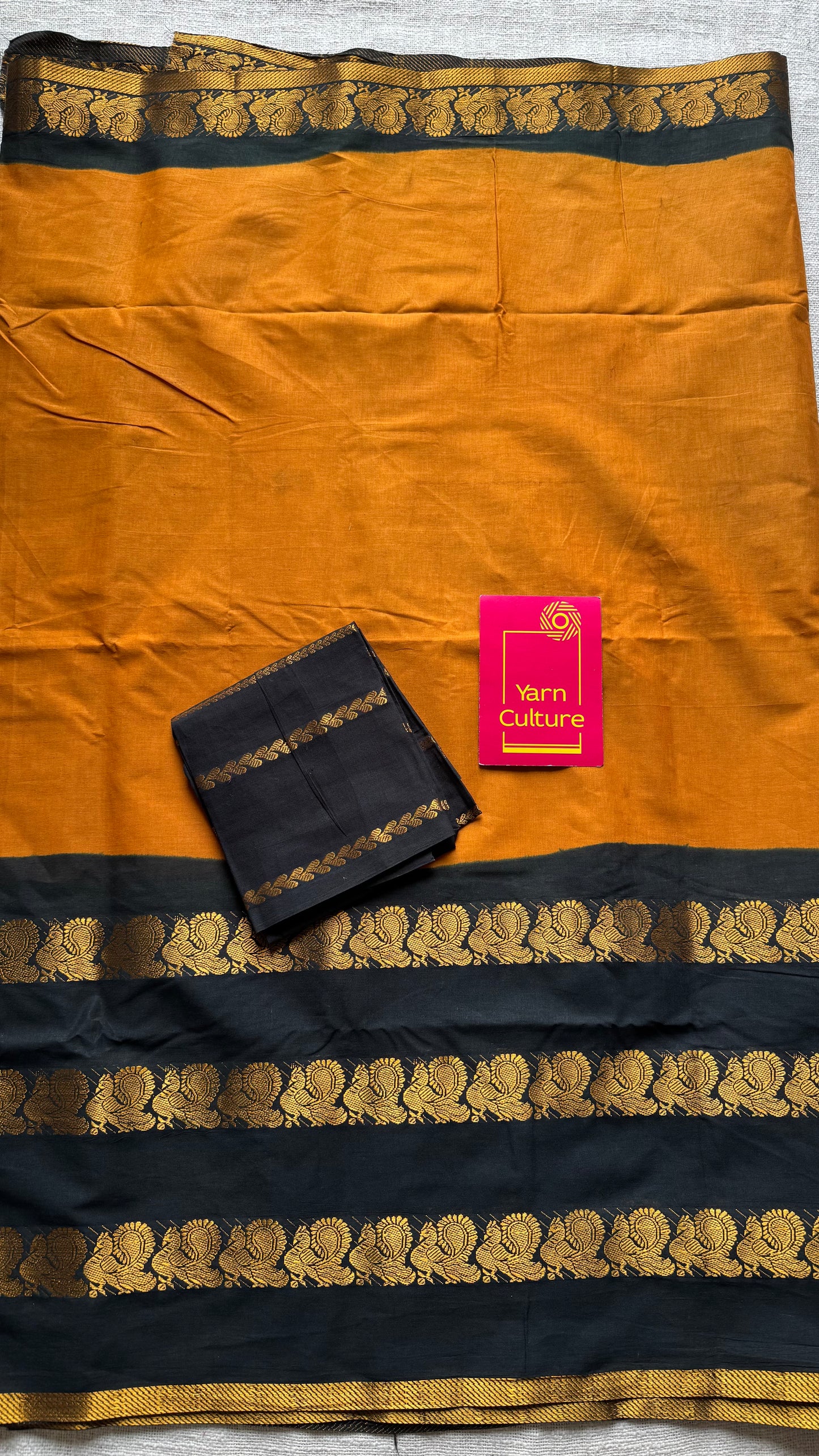 Dark turmeric and black sungudi with triple peacock motif rettai pettu wide border - YCCOTNSEMS46