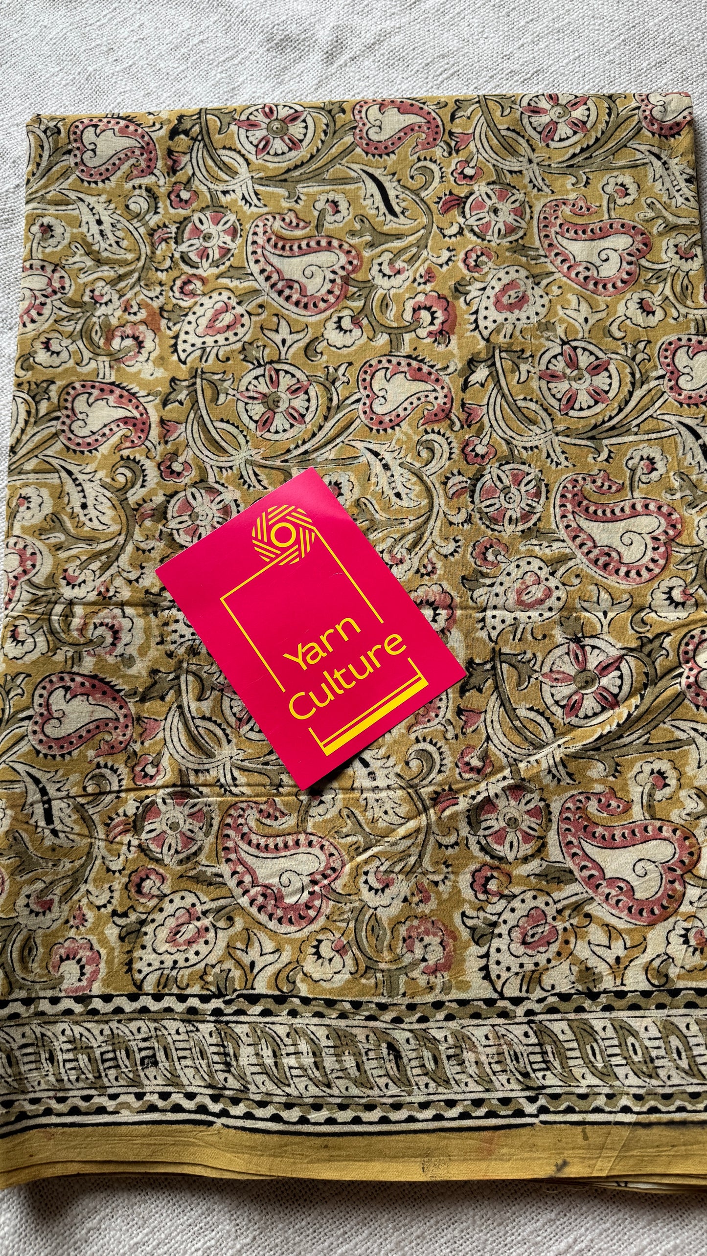 Ginger yellow kalamkari, pink floral vines, floral motif pallu