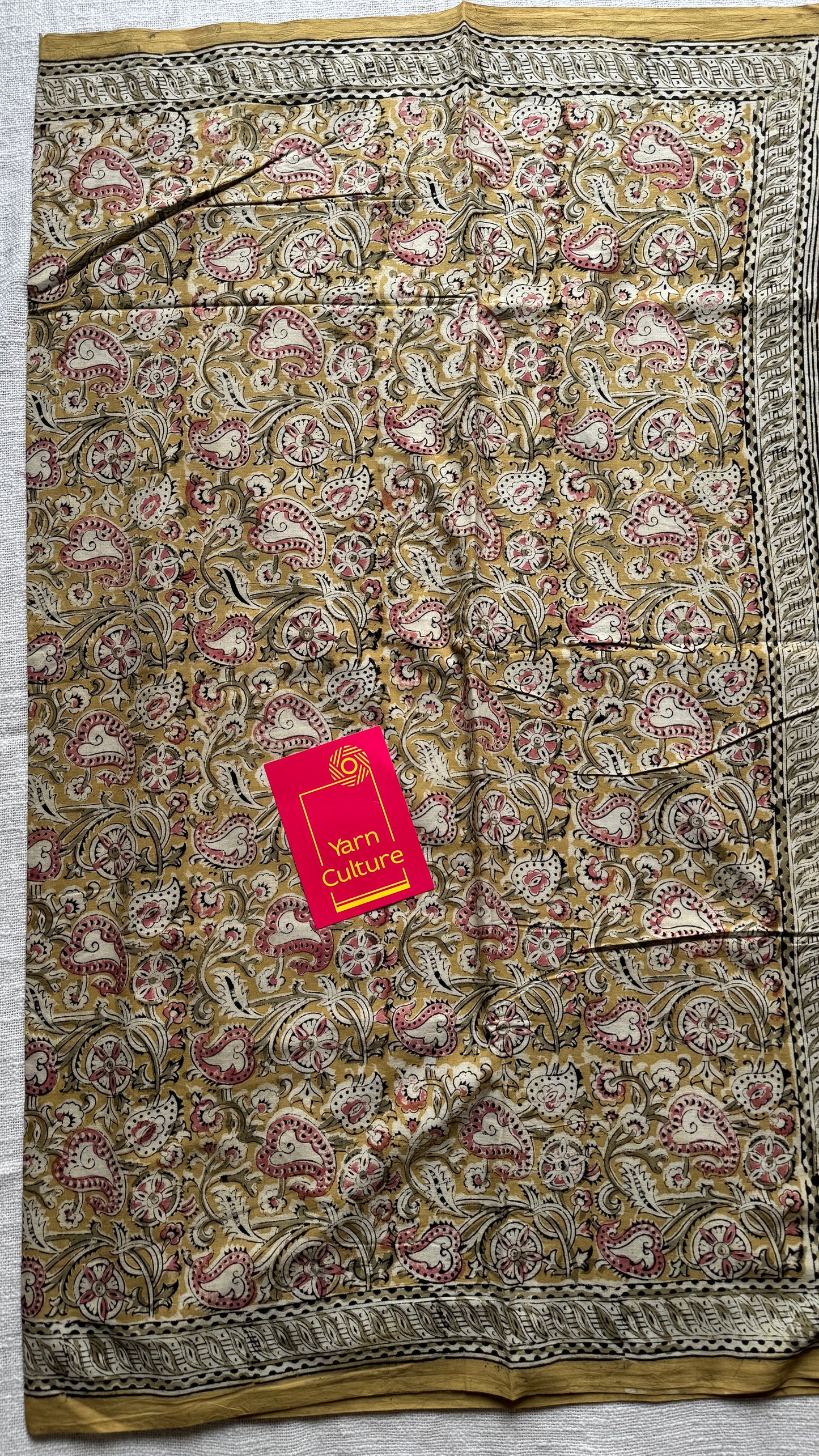 Ginger yellow kalamkari, pink floral vines, floral motif pallu