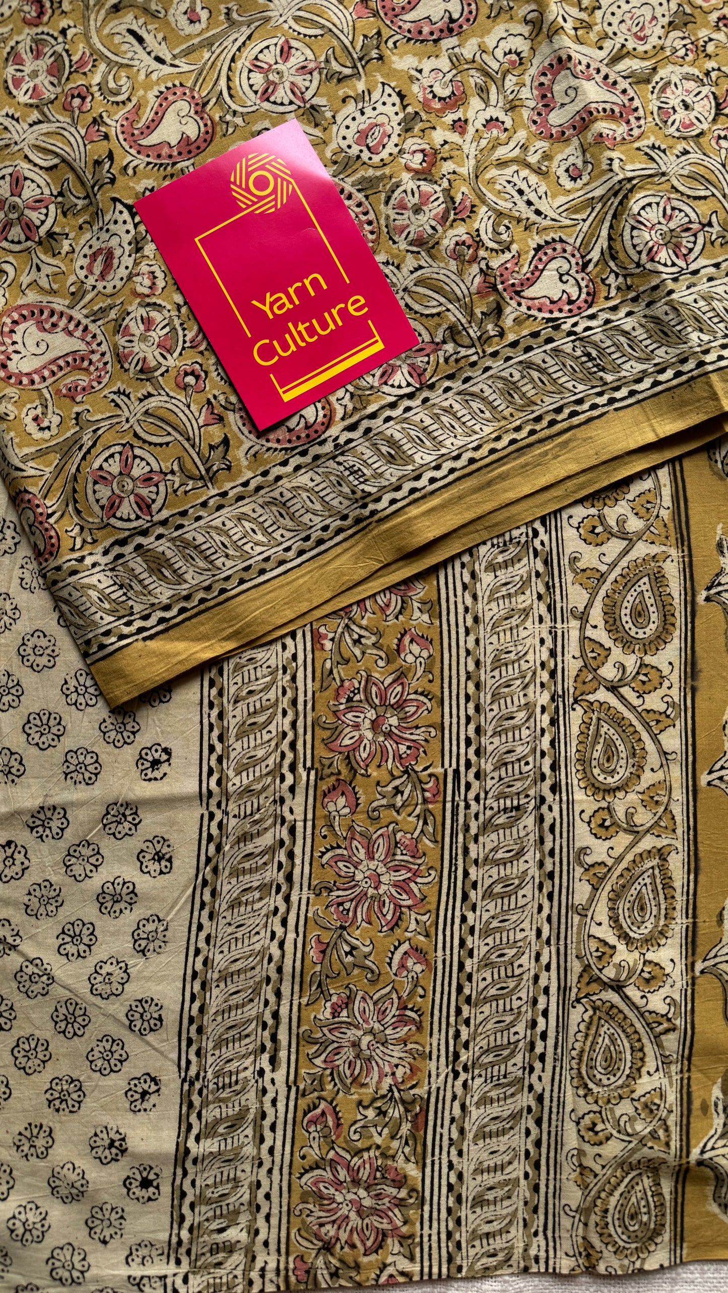 Ginger yellow kalamkari, pink floral vines, floral motif pallu