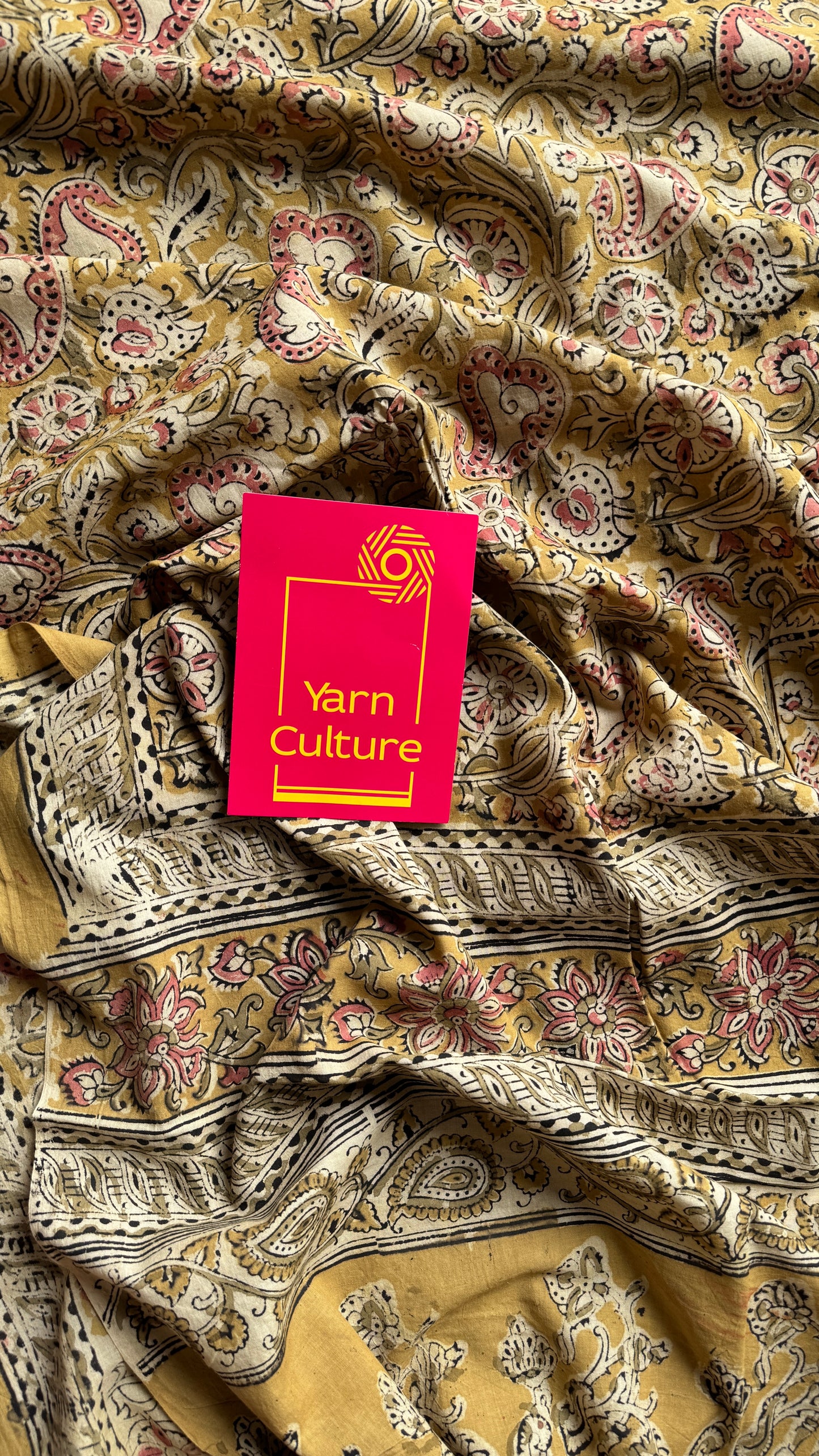 Ginger yellow kalamkari, pink floral vines, floral motif pallu