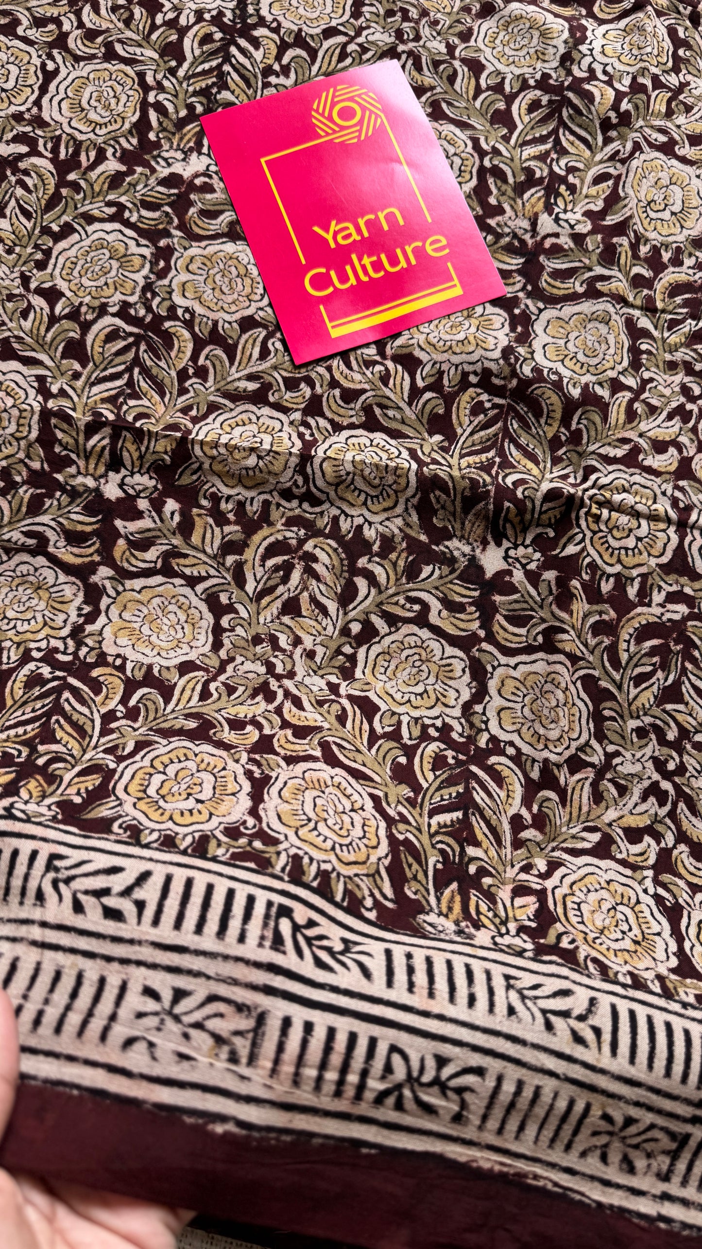 Dark maroon kalamkari, yellow floral vines, floral motif pallu