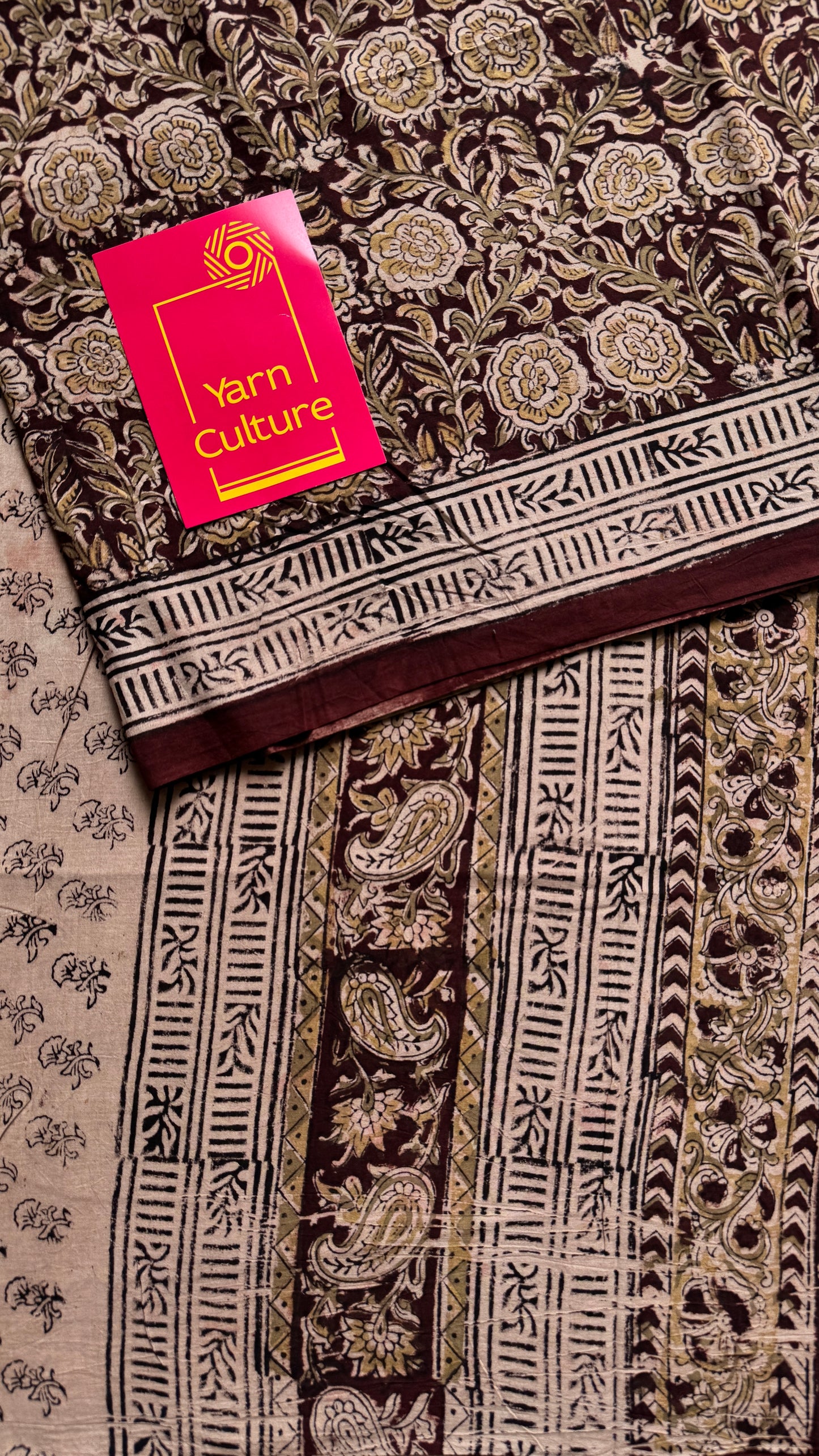 Dark maroon kalamkari, yellow floral vines, floral motif pallu