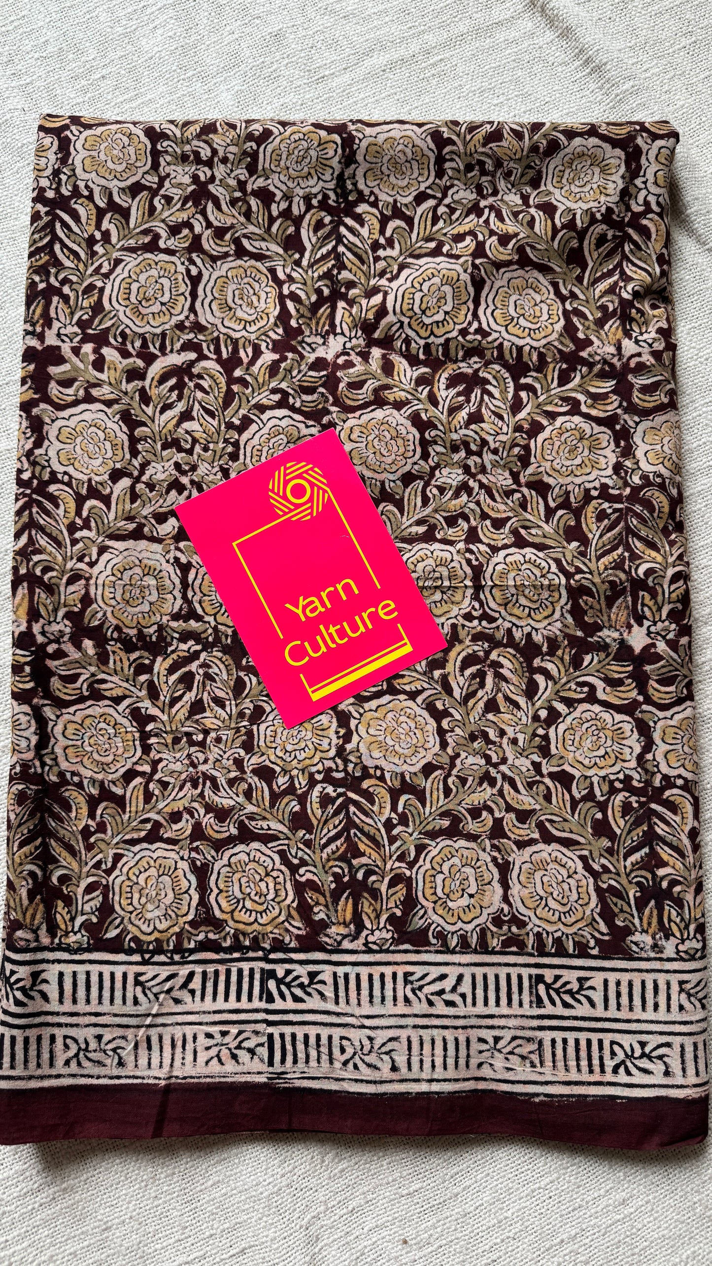 Dark maroon kalamkari, yellow floral vines, floral motif pallu