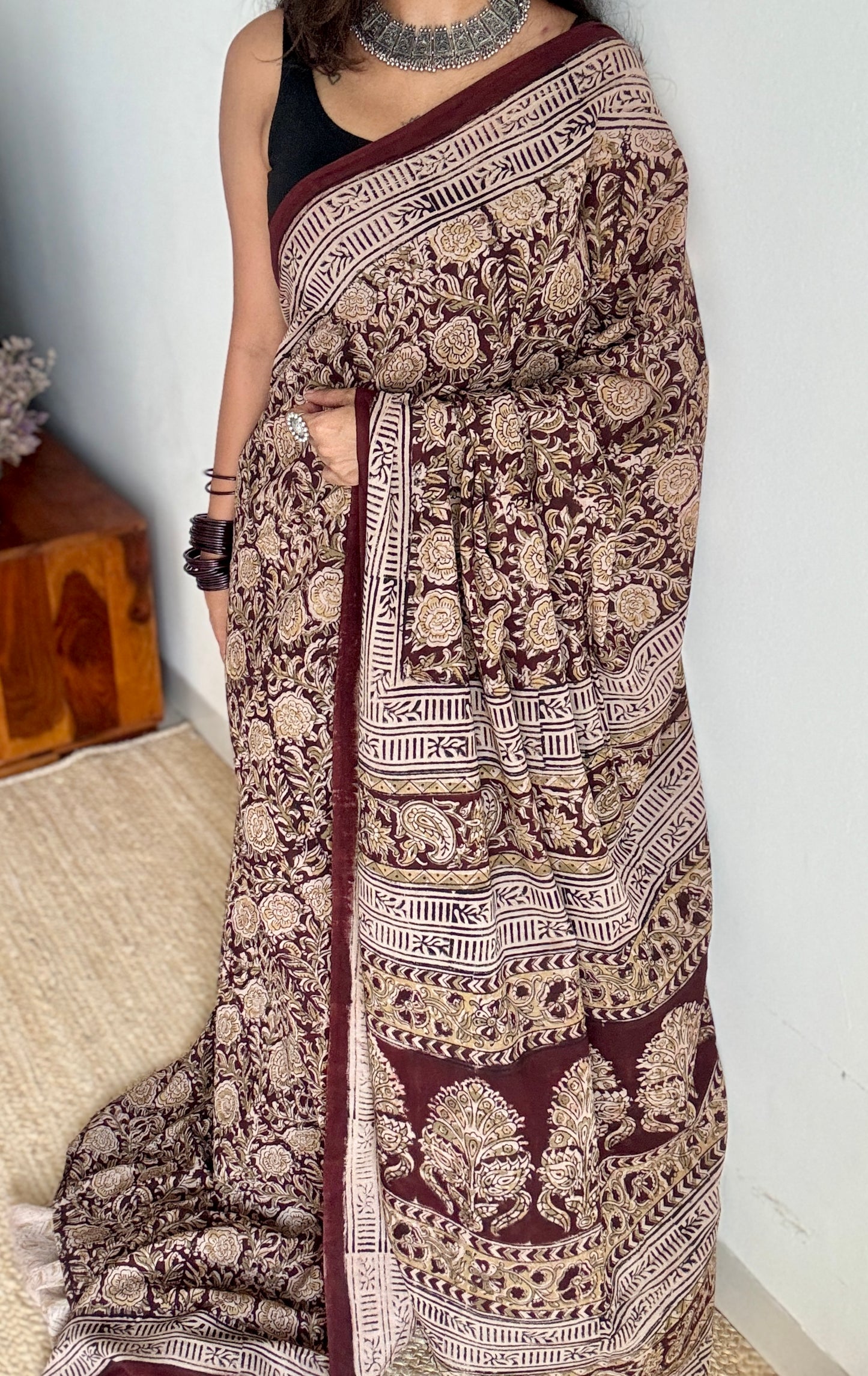 Dark maroon kalamkari, yellow floral vines, floral motif pallu