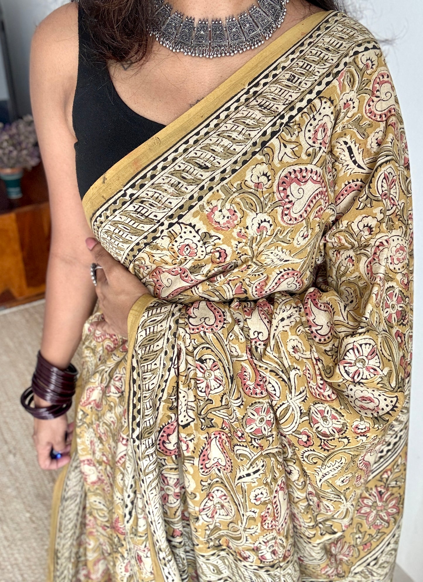 Ginger yellow kalamkari, pink floral vines, floral motif pallu