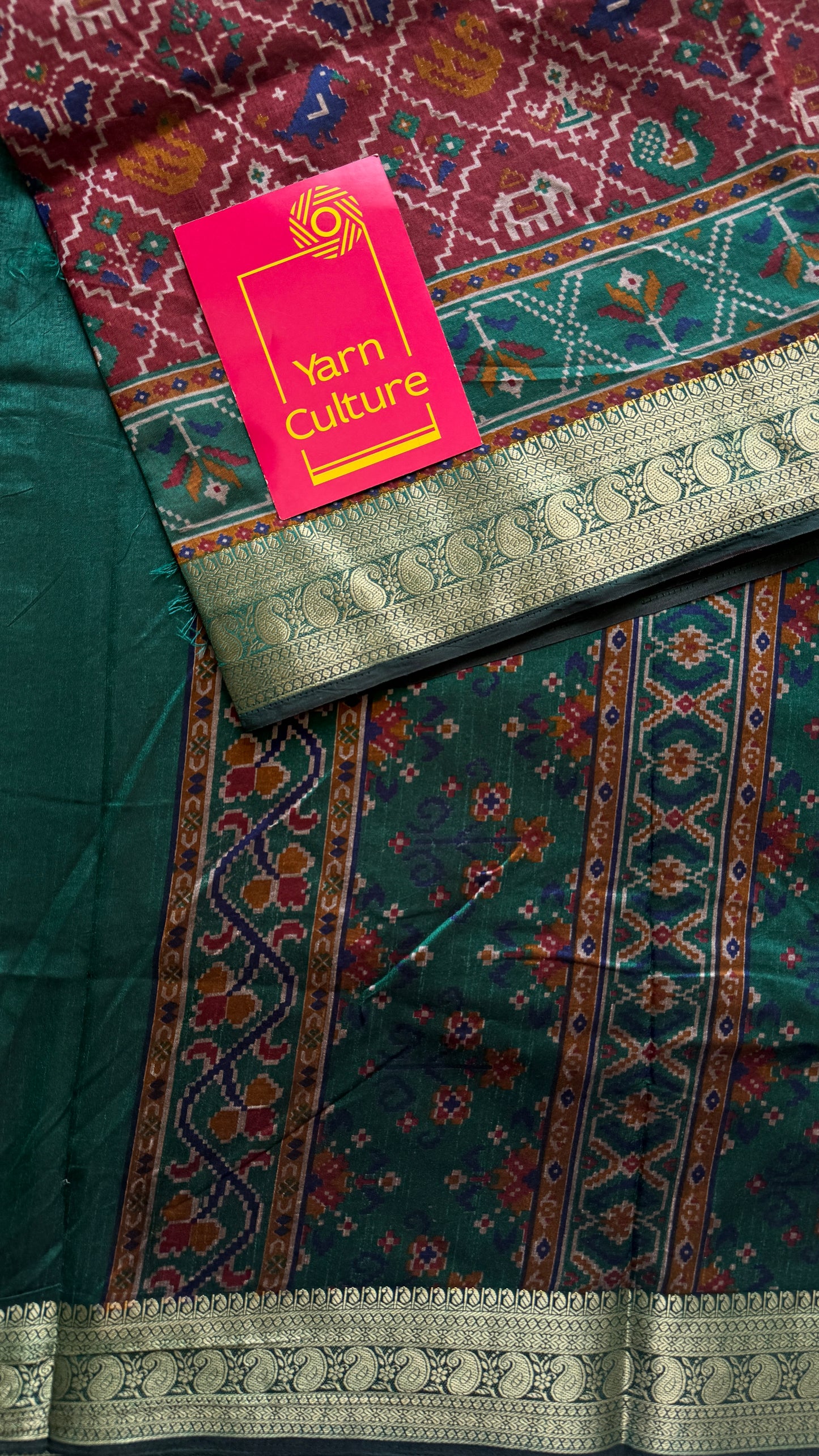 Maroon with green in patola pattern - dola silk