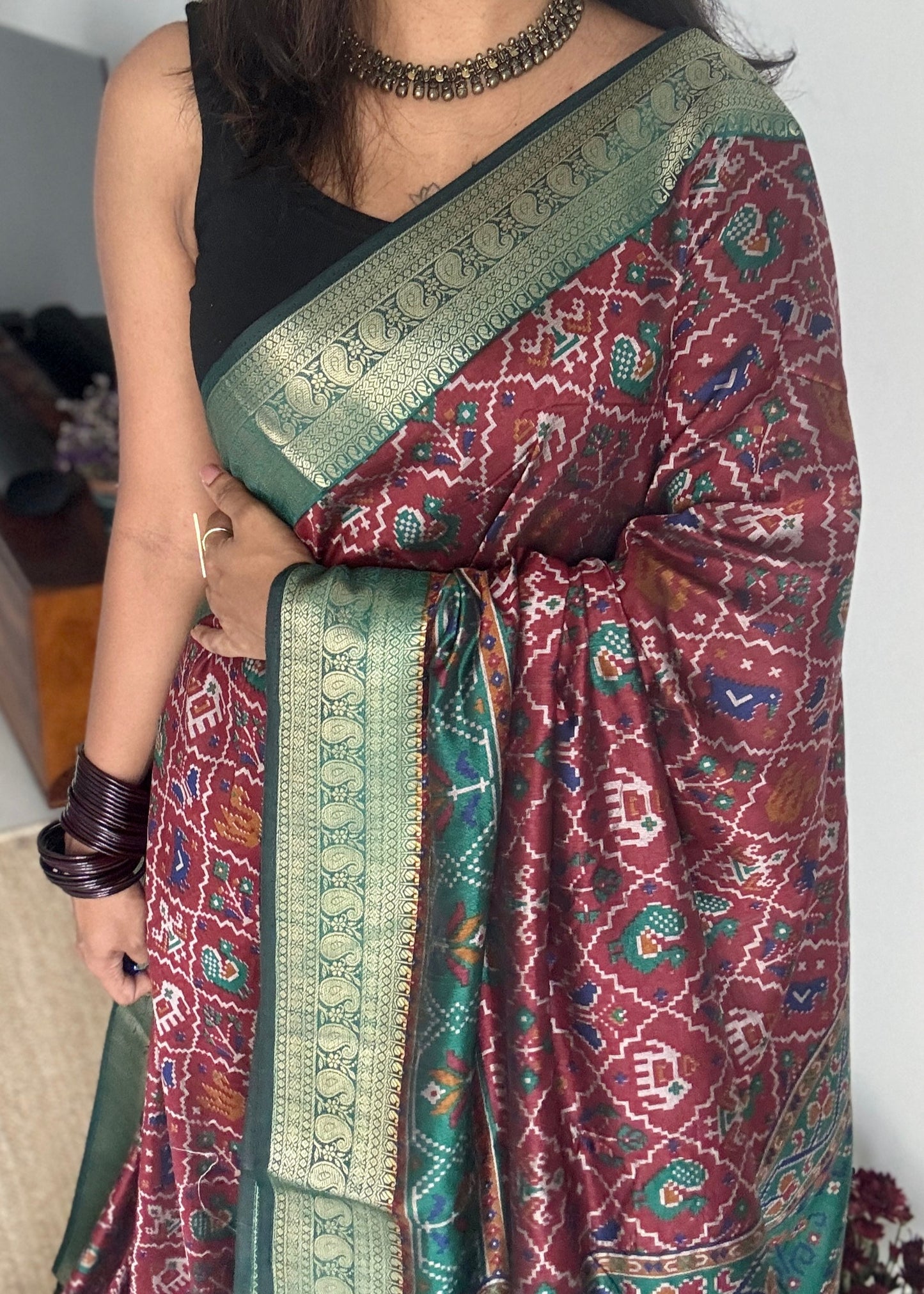 Maroon with green in patola pattern - dola silk