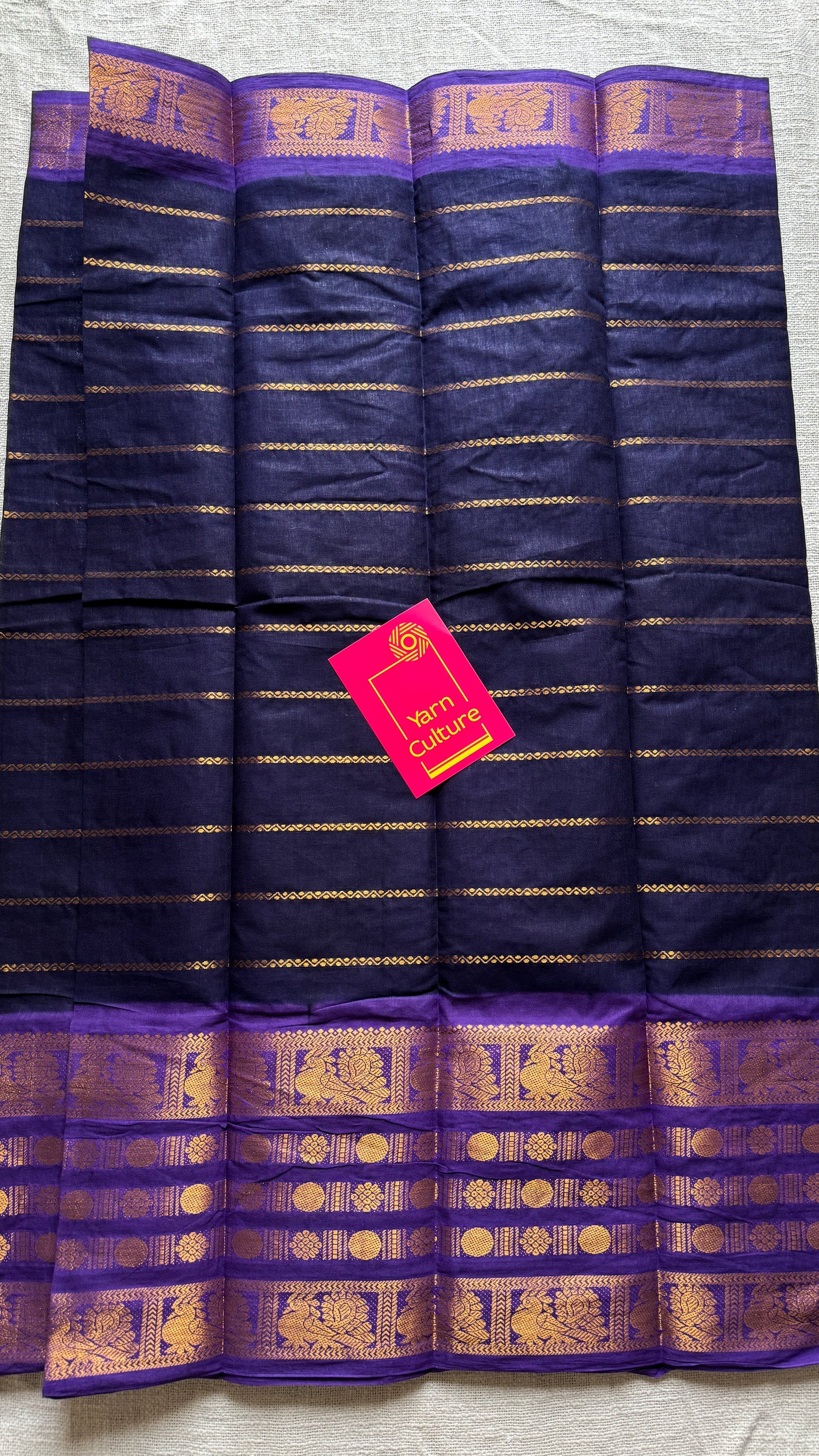 Black and violet sungudi with peacock motif rettai pettu wide border
