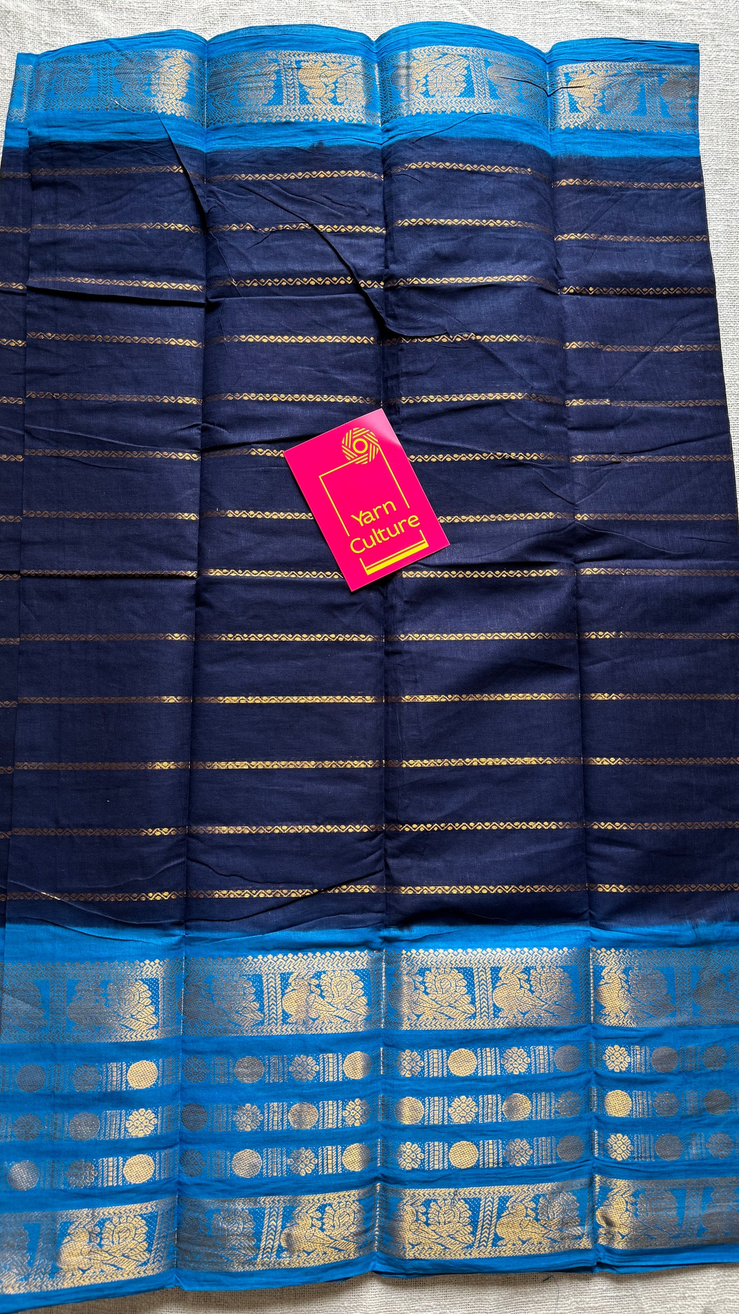 Dark blue and light blue sungudi with peacock motif rettai pettu wide border