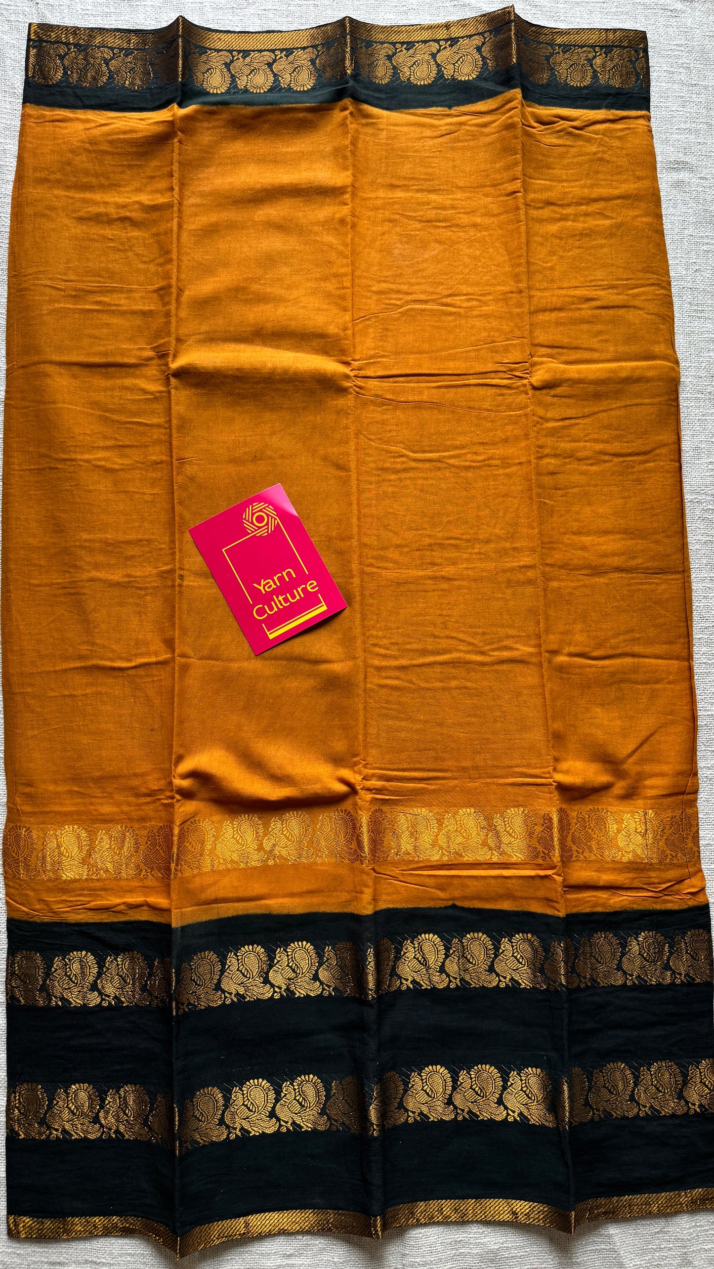 Dark Yellow and black sungudi with double peacock motif rettai pettu wide border