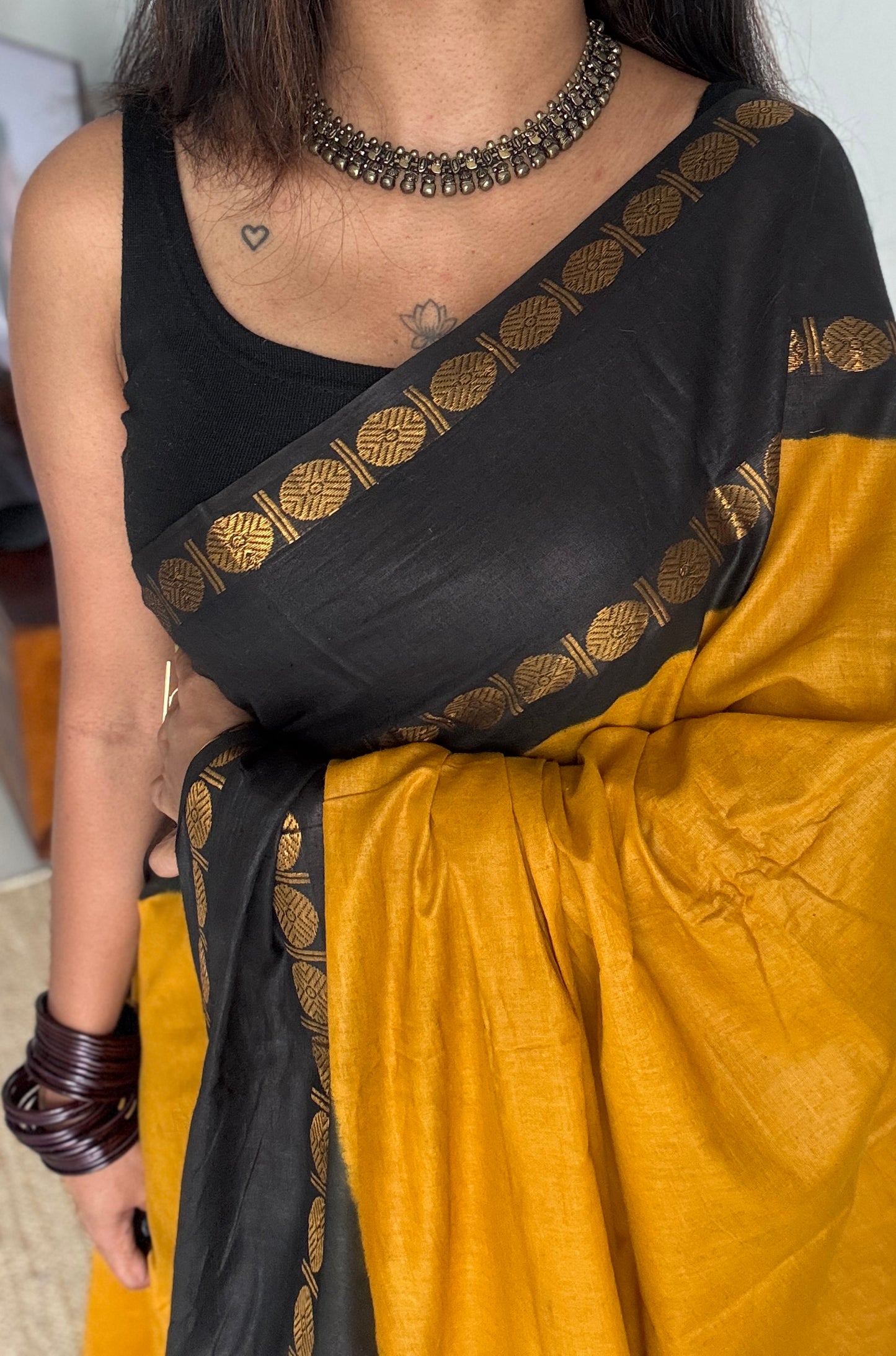 Dark yellow with black rudraksham motif border