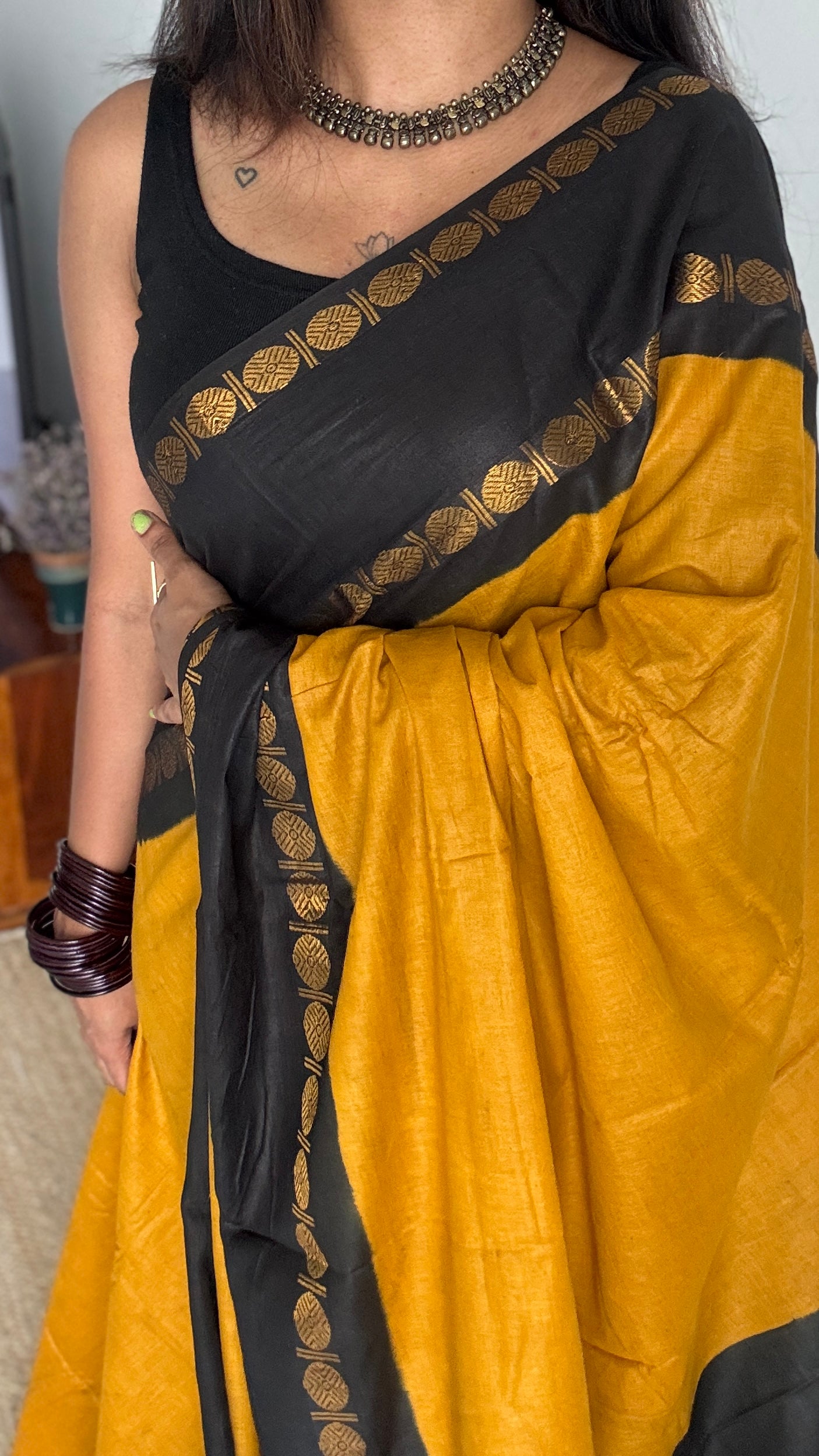Dark yellow with black rudraksham motif border