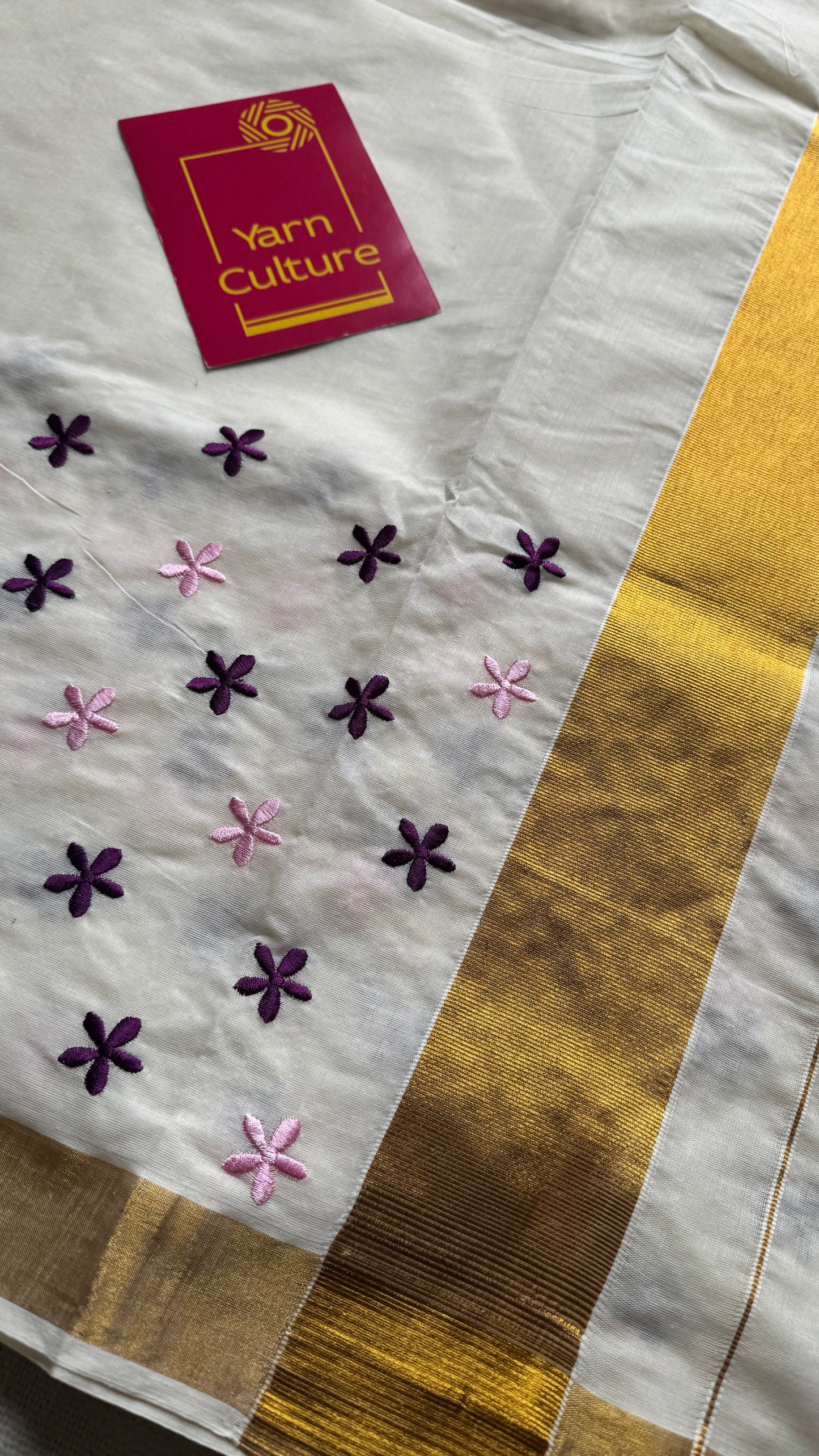 Anjana : Delicate purple and light pink flowers embroidered in soft Kerala cotton - YCONKCE156