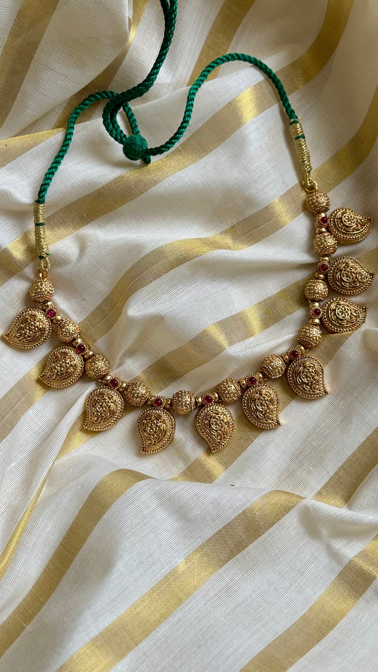 Mango shaped pendants with red stones in antique gold, necklace - YCAGC20