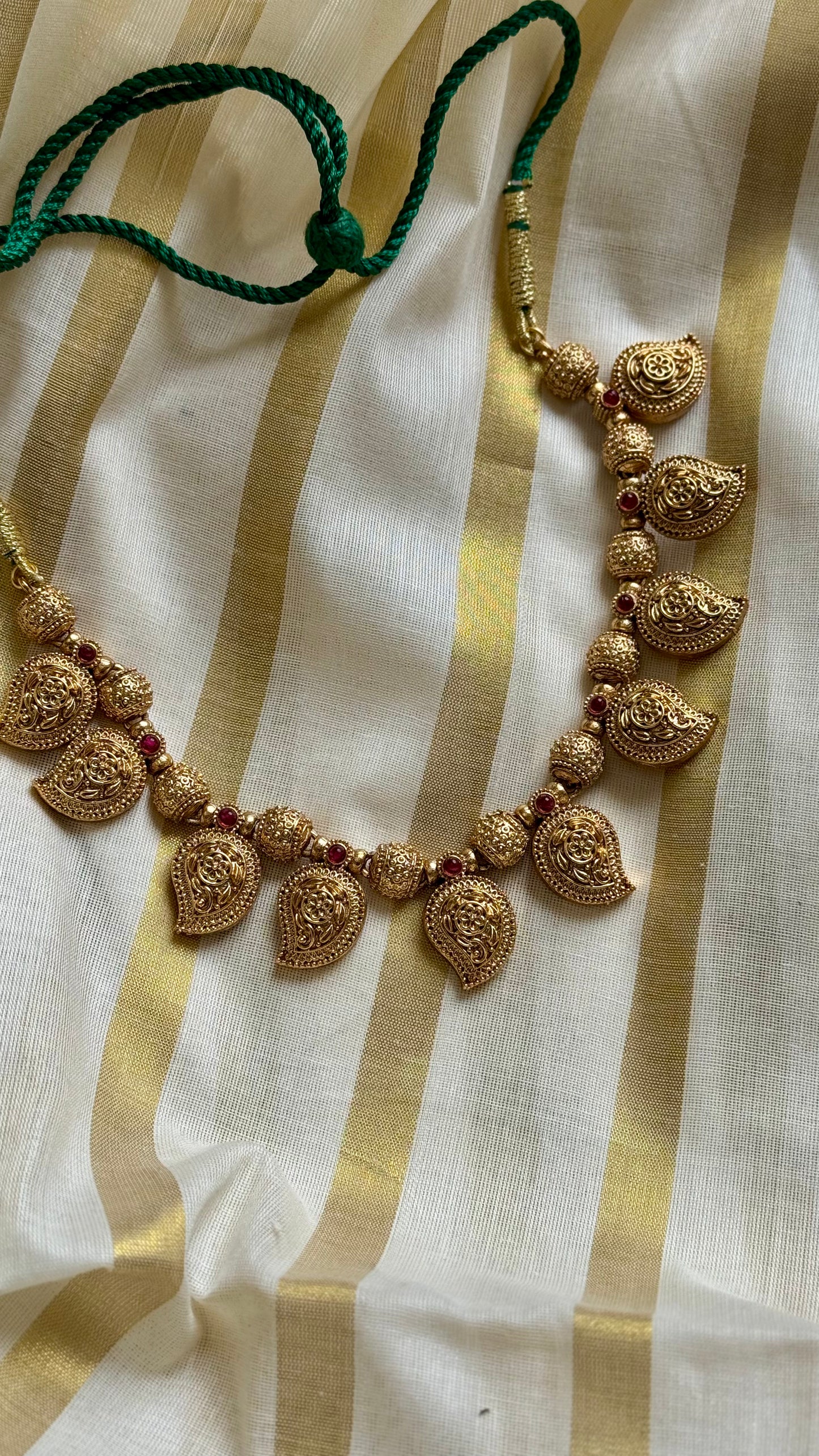 Mango shaped pendants with red stones in antique gold, necklace - YCAGC20