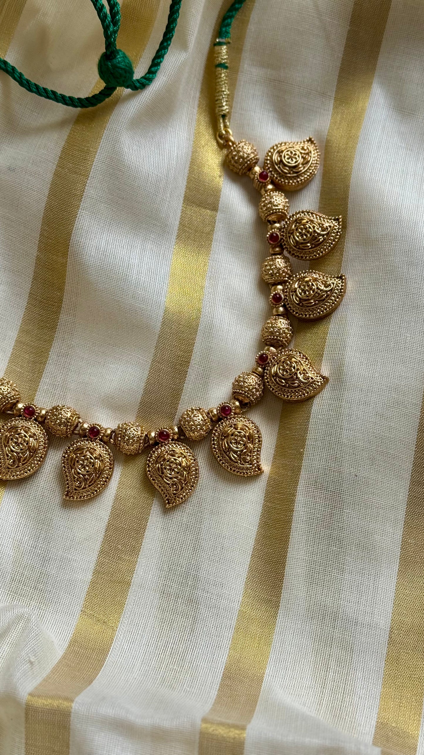 Mango shaped pendants with red stones in antique gold, necklace - YCAGC20