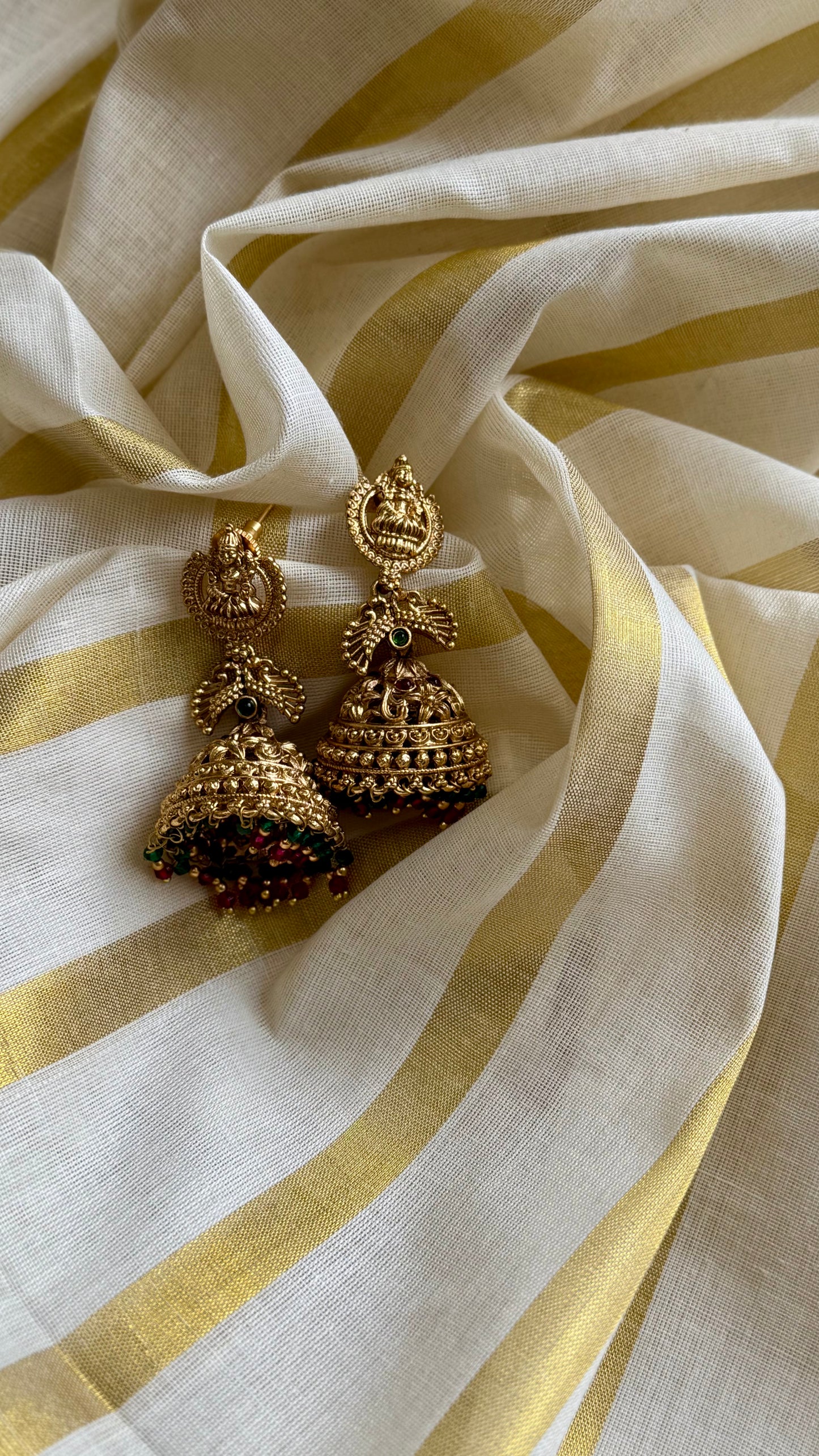 Jhumka with green and dark pink bead drops, gold finishing - YCAGJK87