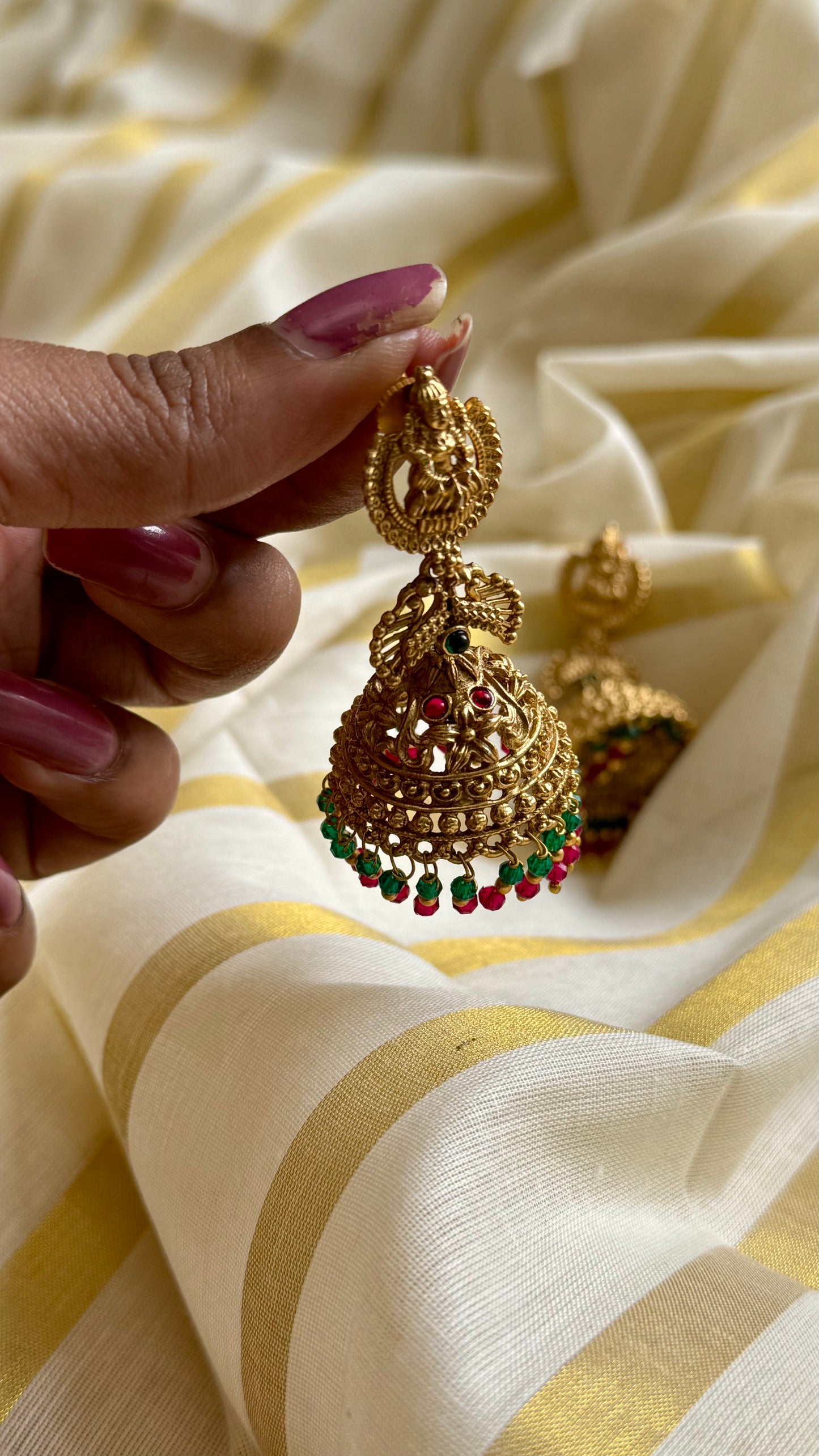Jhumka with green and dark pink bead drops, gold finishing - YCAGJK87