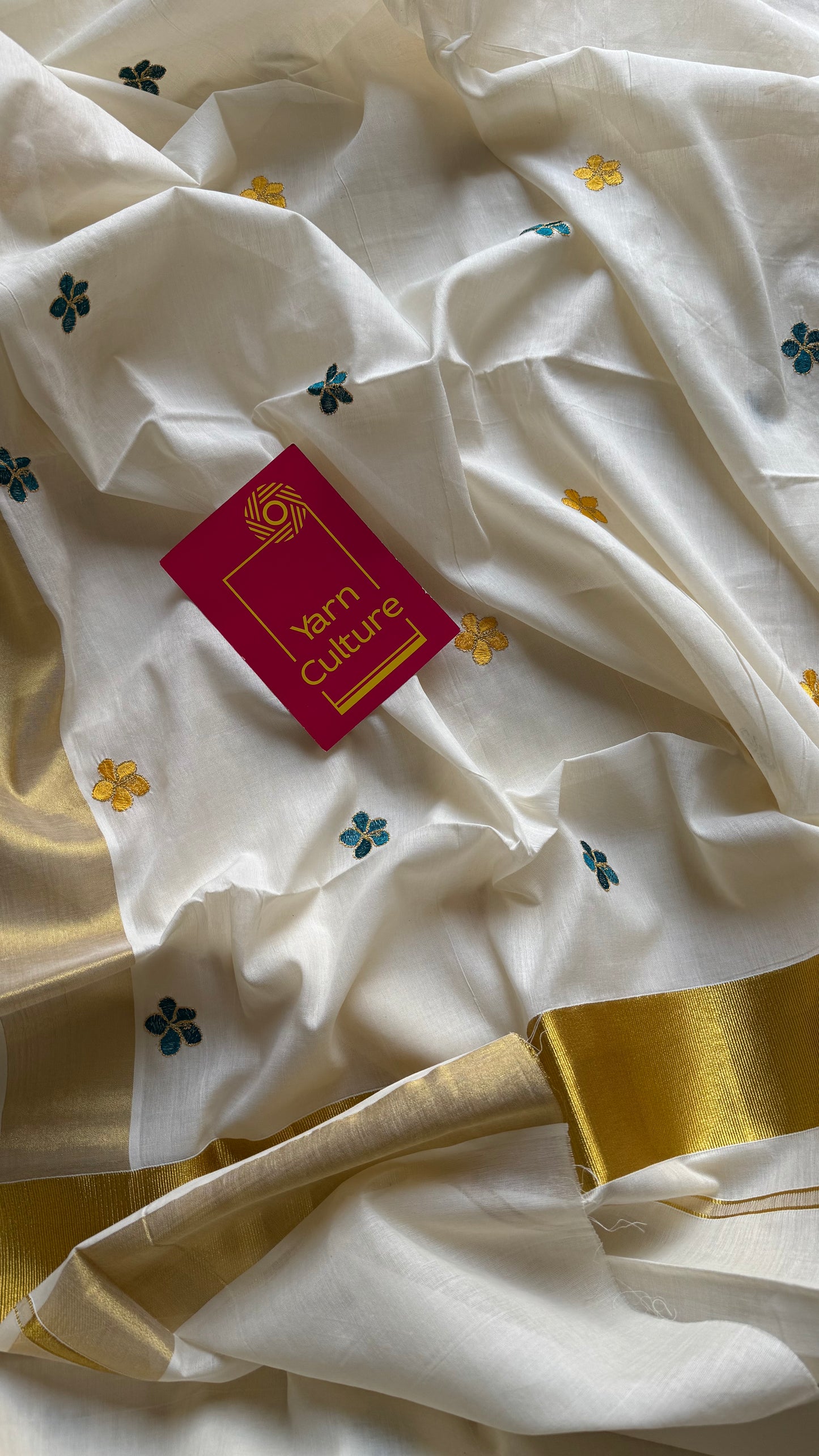 Ivory and gold saree with peacock blue and yellow floral embroidery - YCIEKCFE309