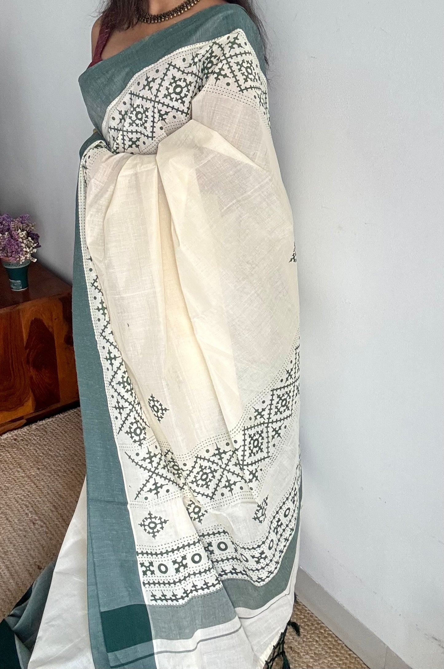 Ivory Kerala cotton saree with green Kutch-inspired printed borders and green centre pleats - YCIEKCFE314