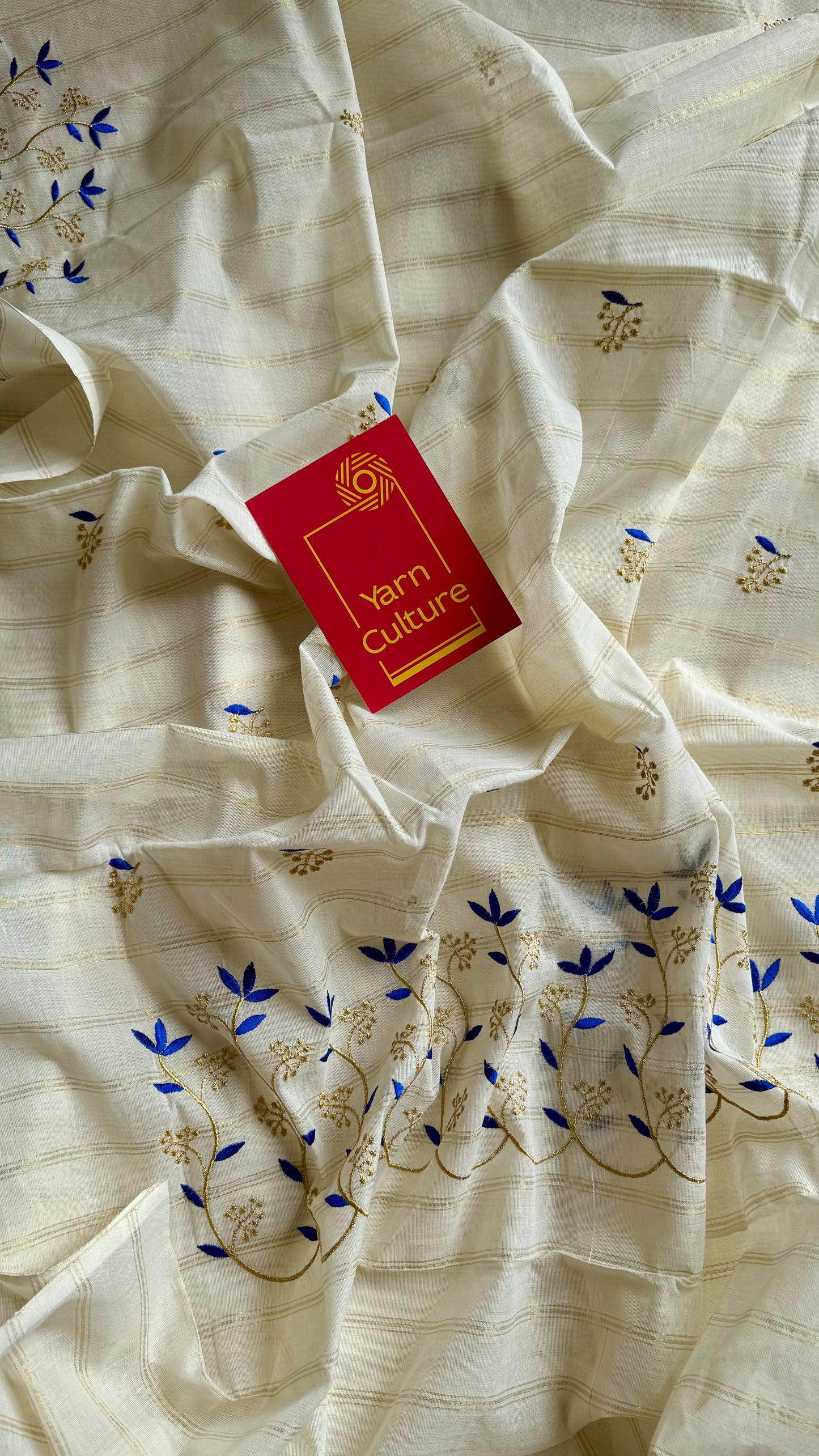 Ivory and gold soft cotton saree, blue floral vine embroidery  - YCIEON55