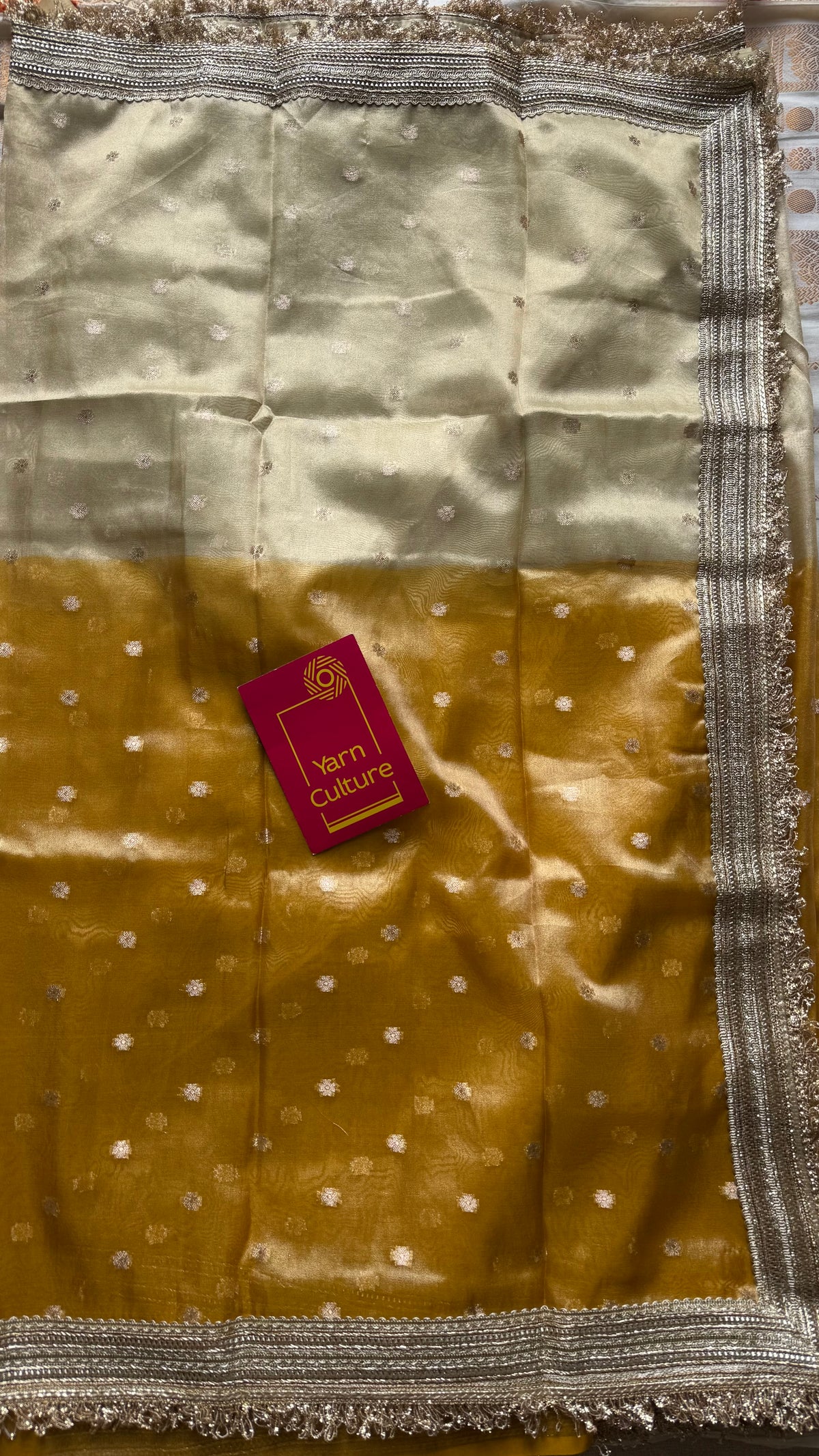 Light gold and dark gold Banarasi tissue saree, with buttas and embellished lace border - YCBLTOC65
