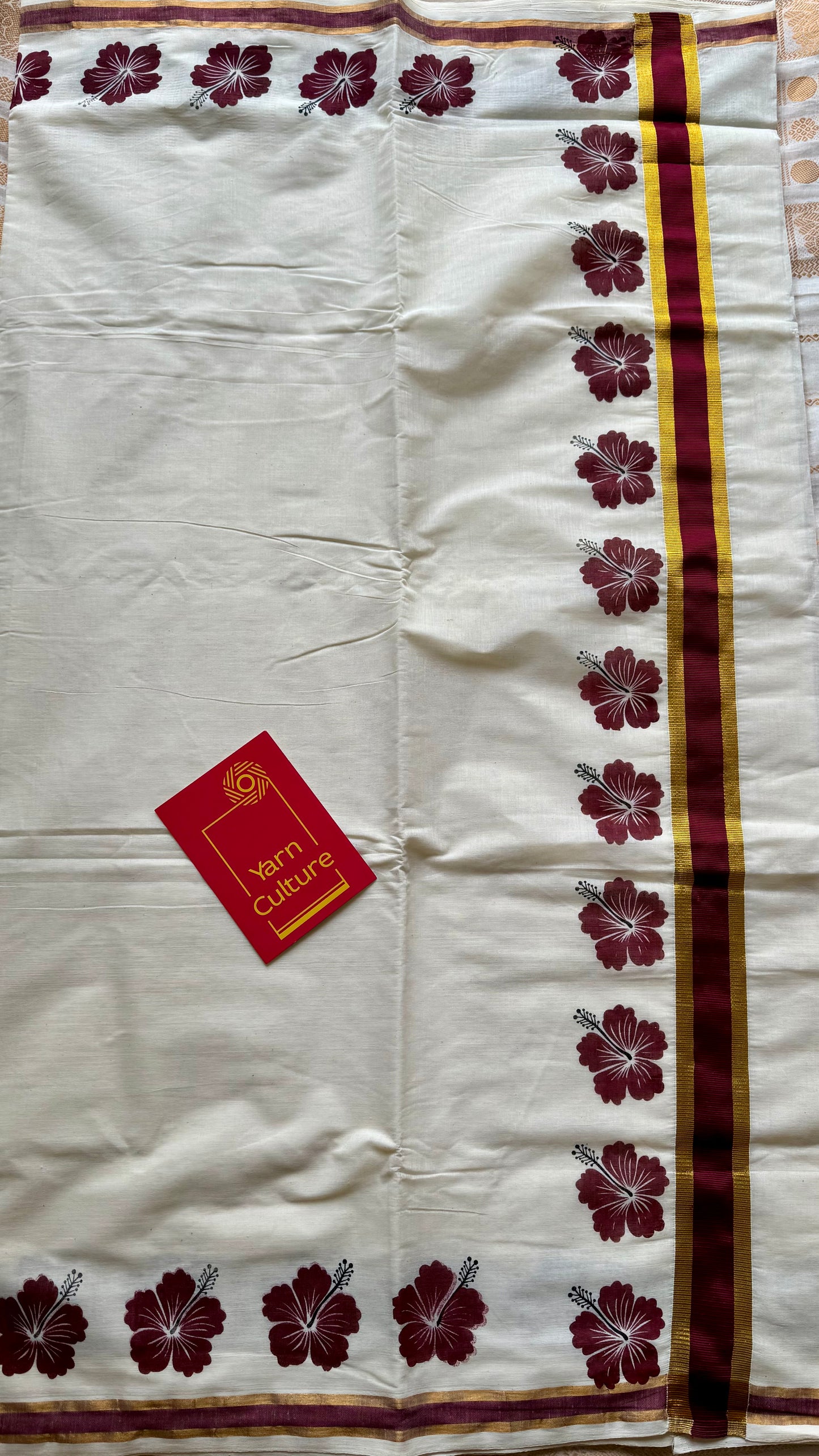 Ivory and gold soft cotton saree, maroon hibiscus (chembarathi) flowers - YCIEON62
