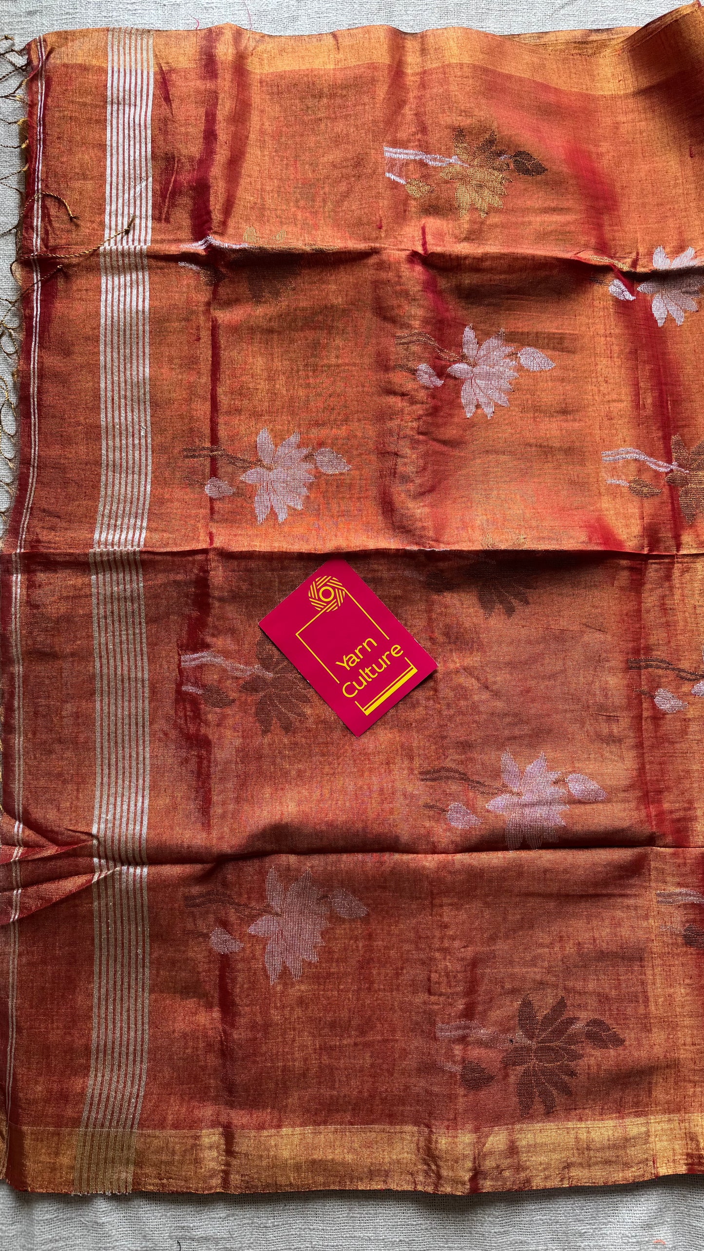 Handwoven orange gold dual tone tissue linen saree with lotus motifs - YCBCLTFE399