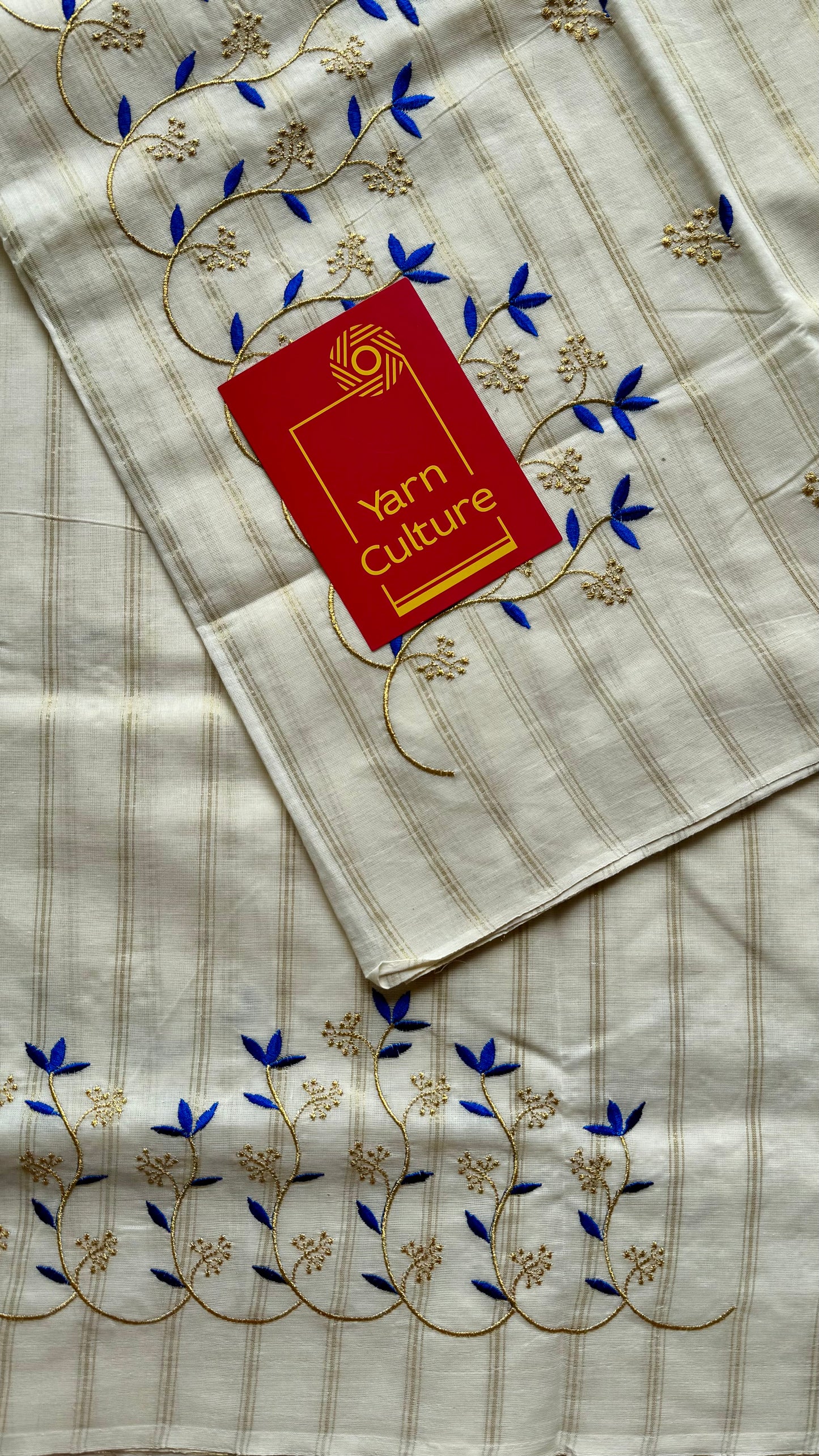 Ivory and gold soft cotton saree, blue floral vine embroidery  - YCIEON55