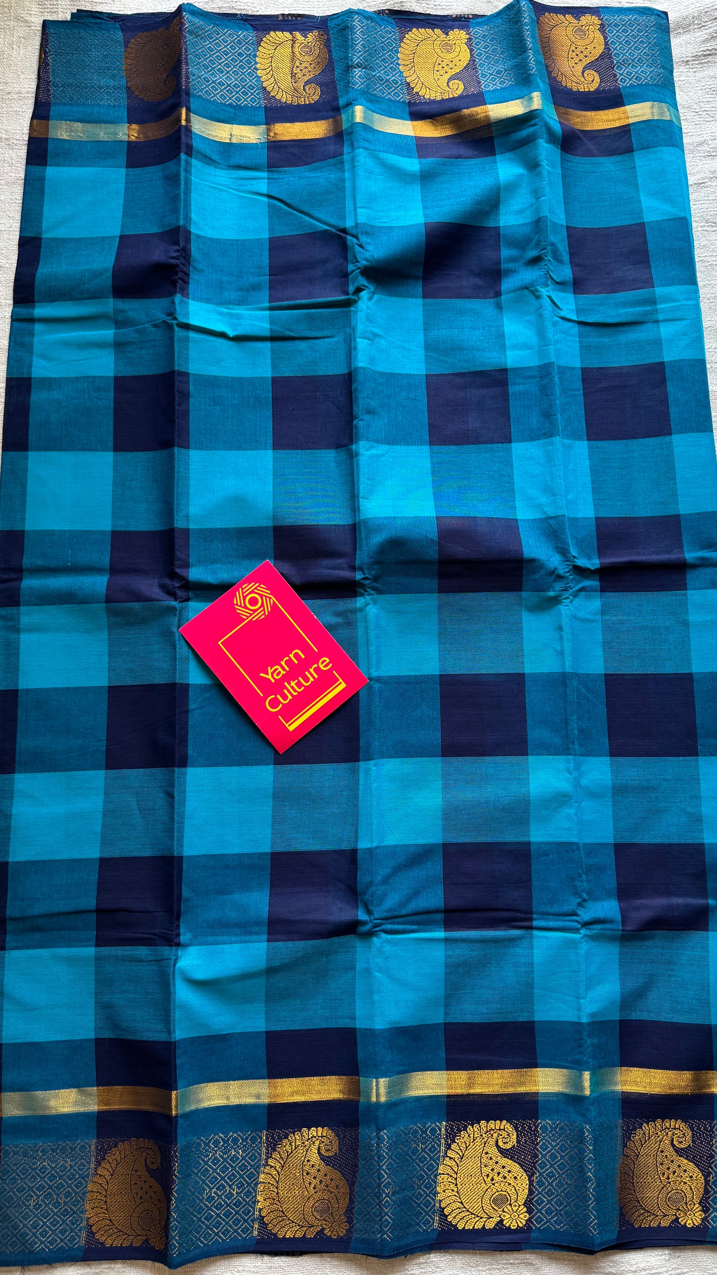 Chettinad cotton saree with sky blue and navy checks, paisley motif border - YCCOTNAP62