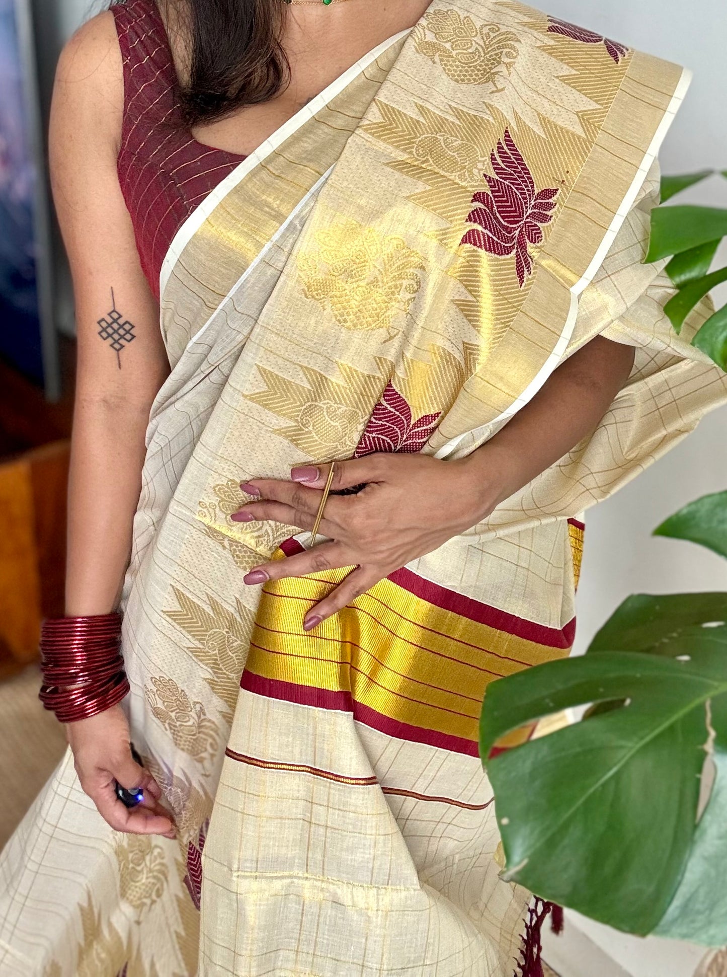 Ivory and gold kerala kasavu saree, maroon lotus motif border - YCIEON48