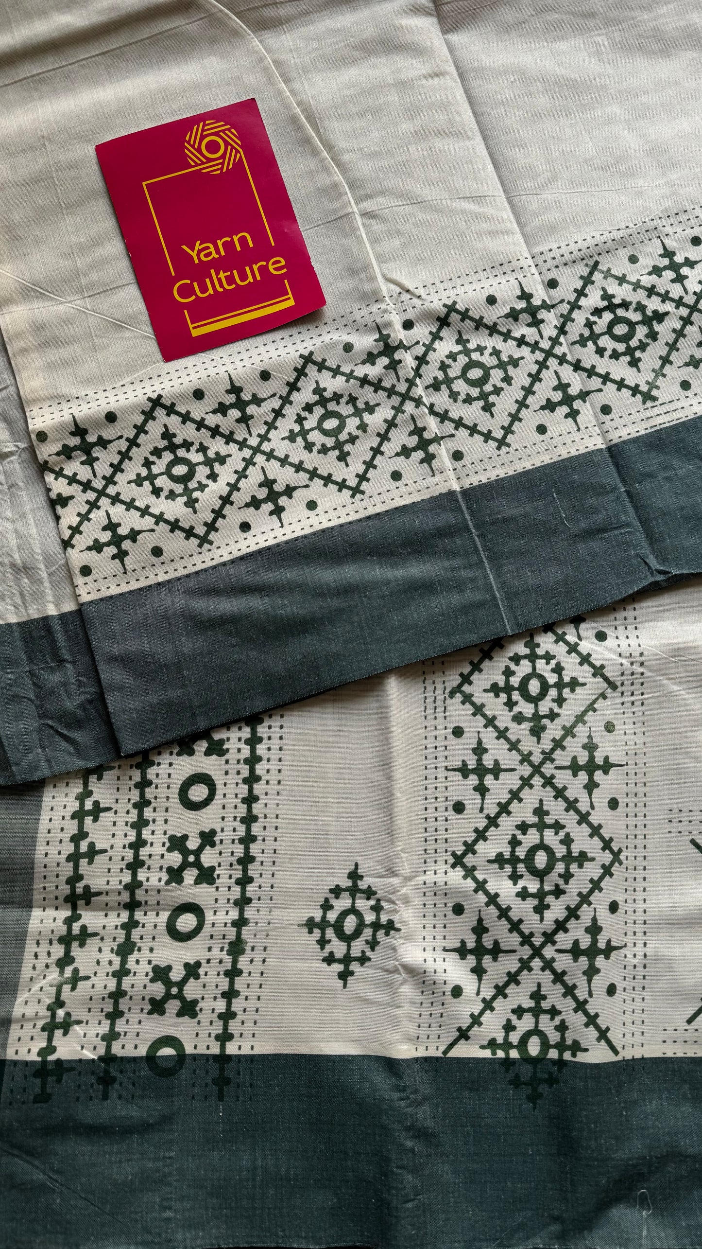 Ivory Kerala cotton saree with green Kutch-inspired printed borders and green centre pleats - YCIEKCFE314