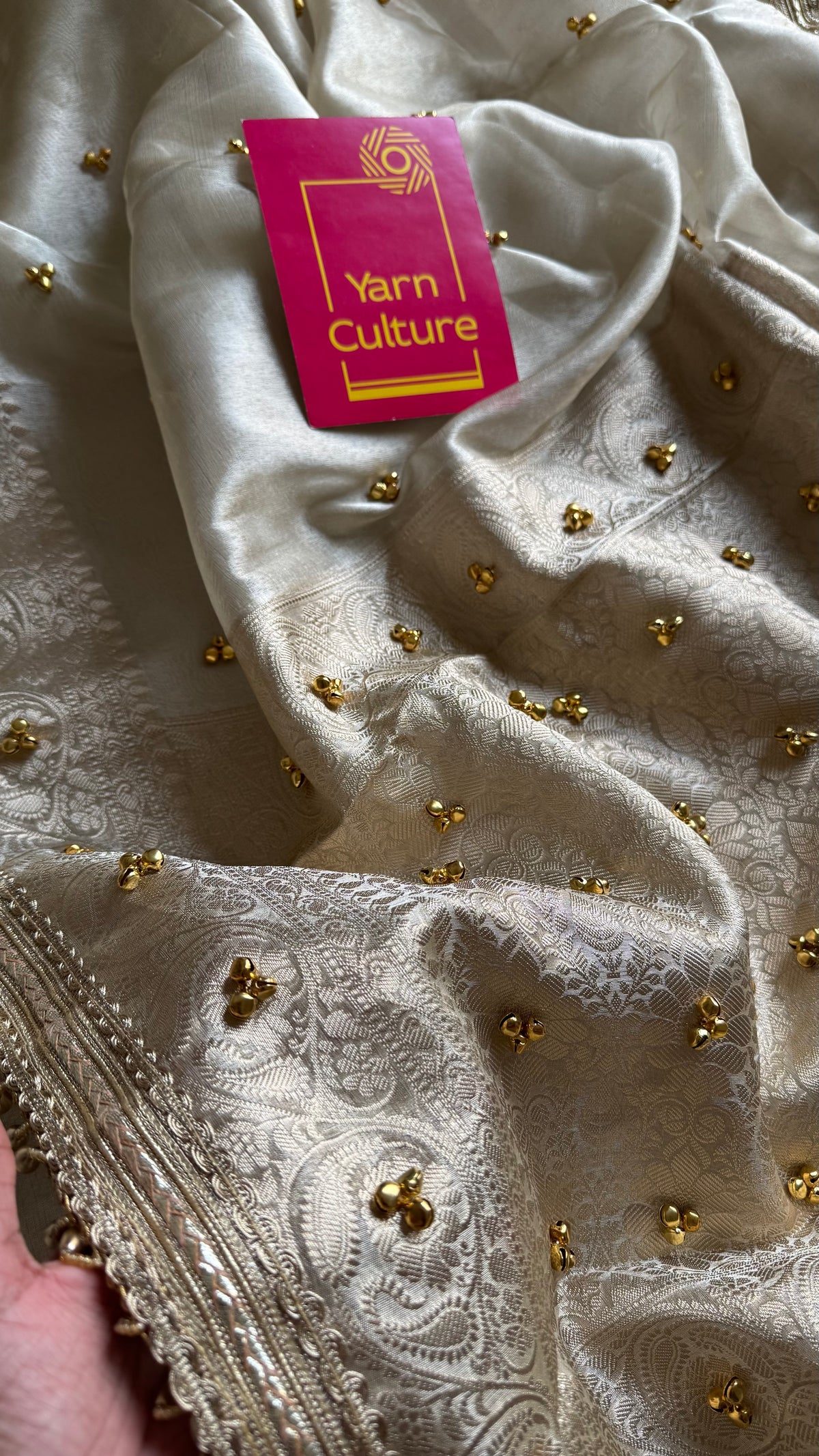 Ivory gold tissue Banarasi saree with ghungroo embellishments and beaded lace zari border - YCBLTOC70